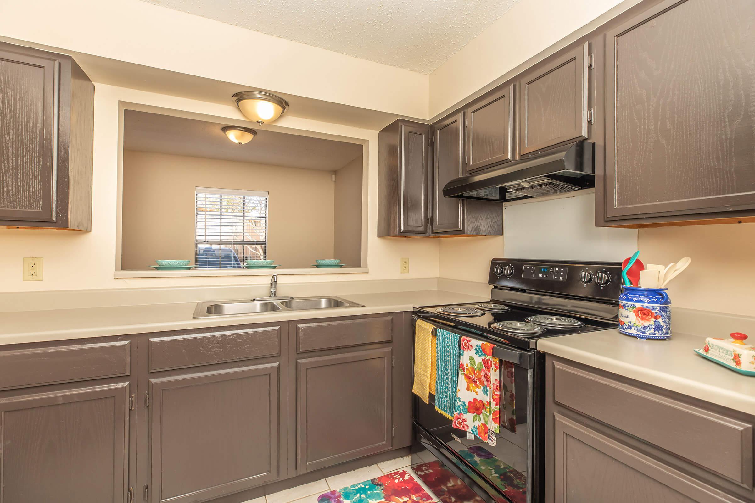 a kitchen with an island in the middle of a room