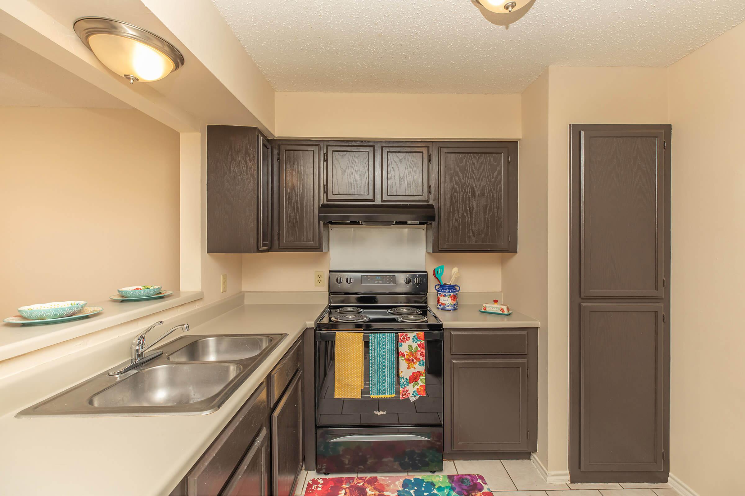 a kitchen with a sink and a microwave