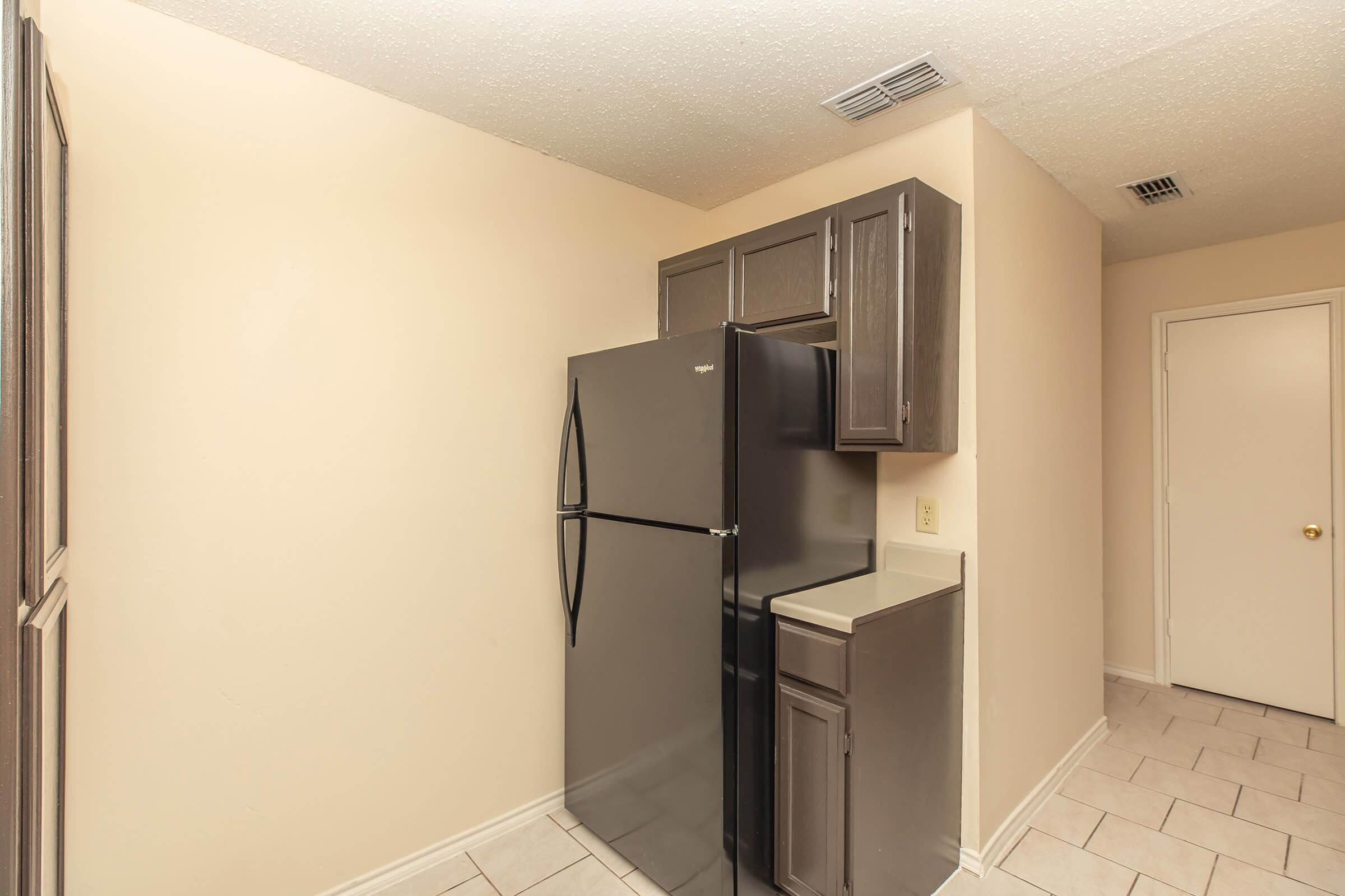 a stainless steel refrigerator in a room