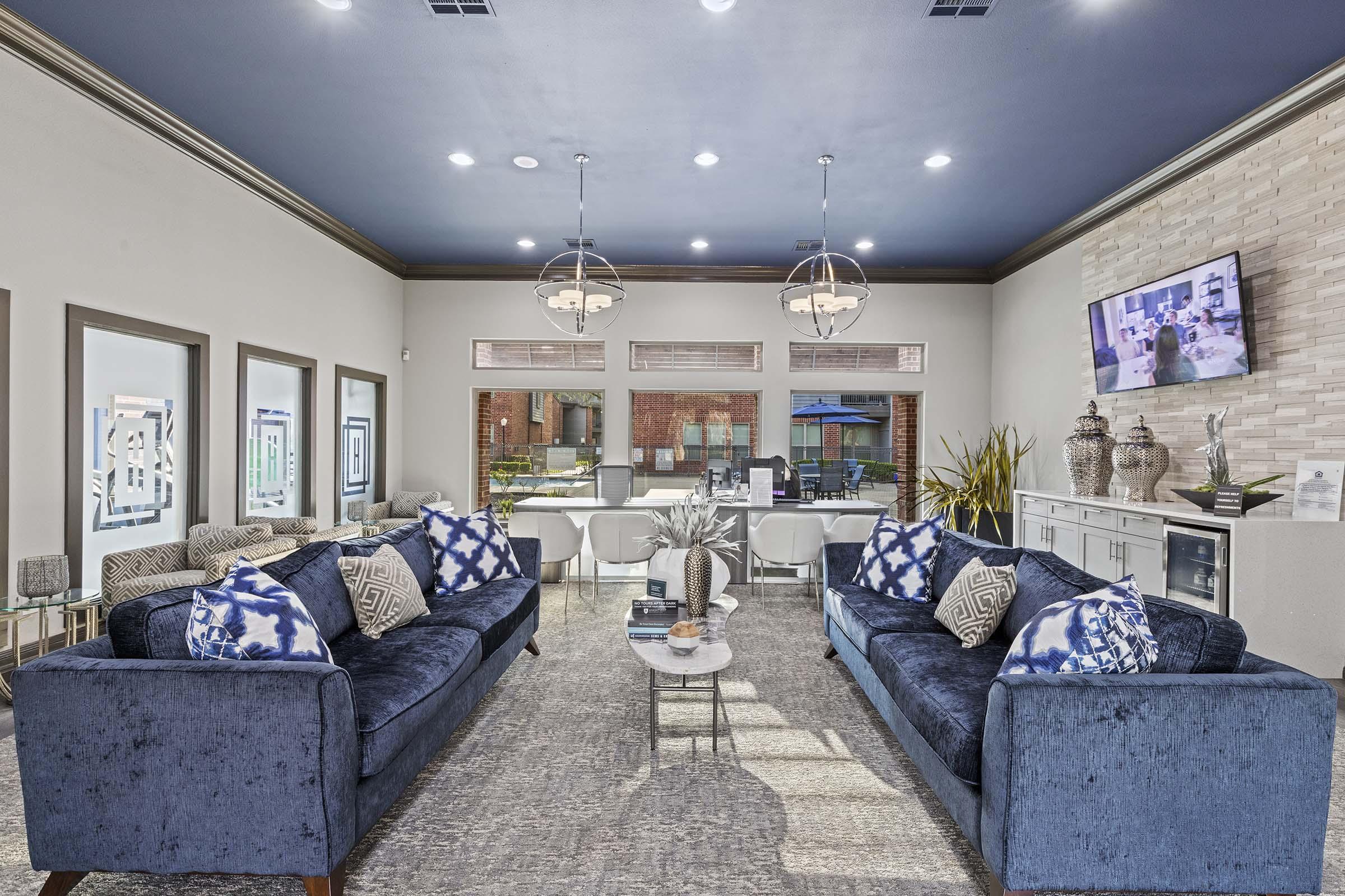 a living room filled with furniture and a fireplace