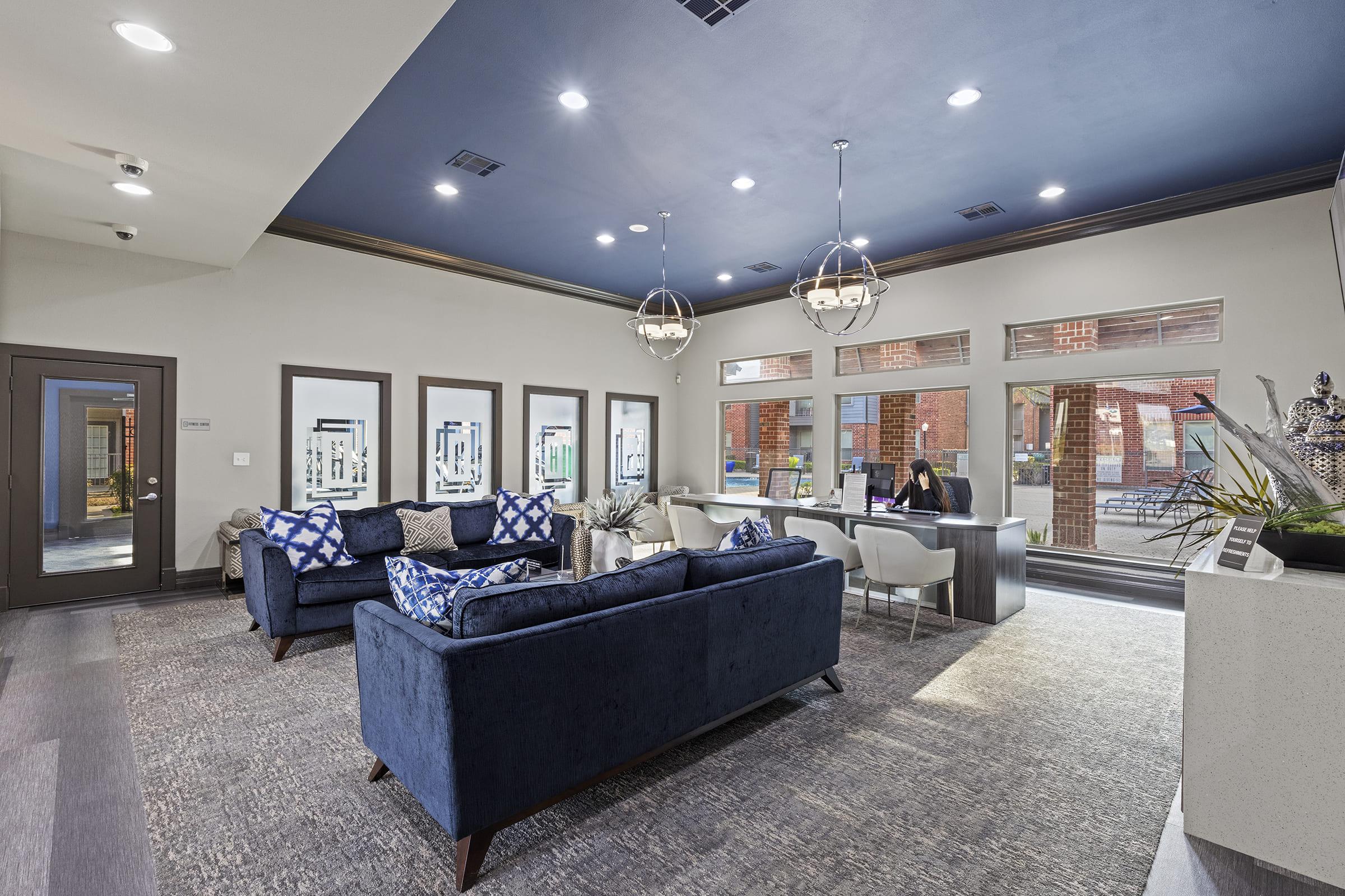 a living room filled with furniture and a flat screen tv