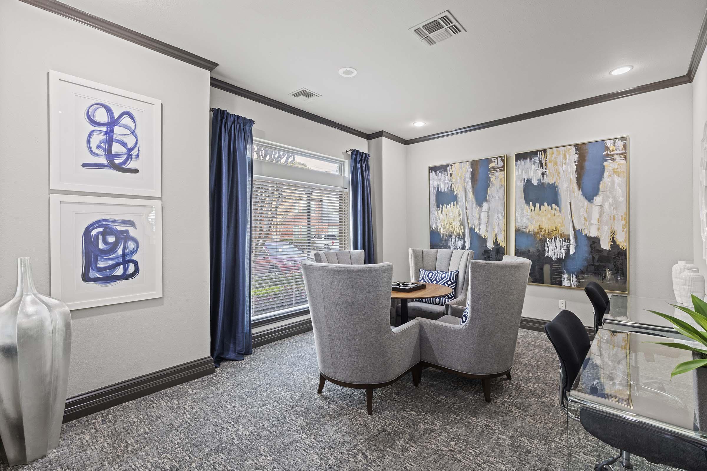 a living room filled with furniture and a large window