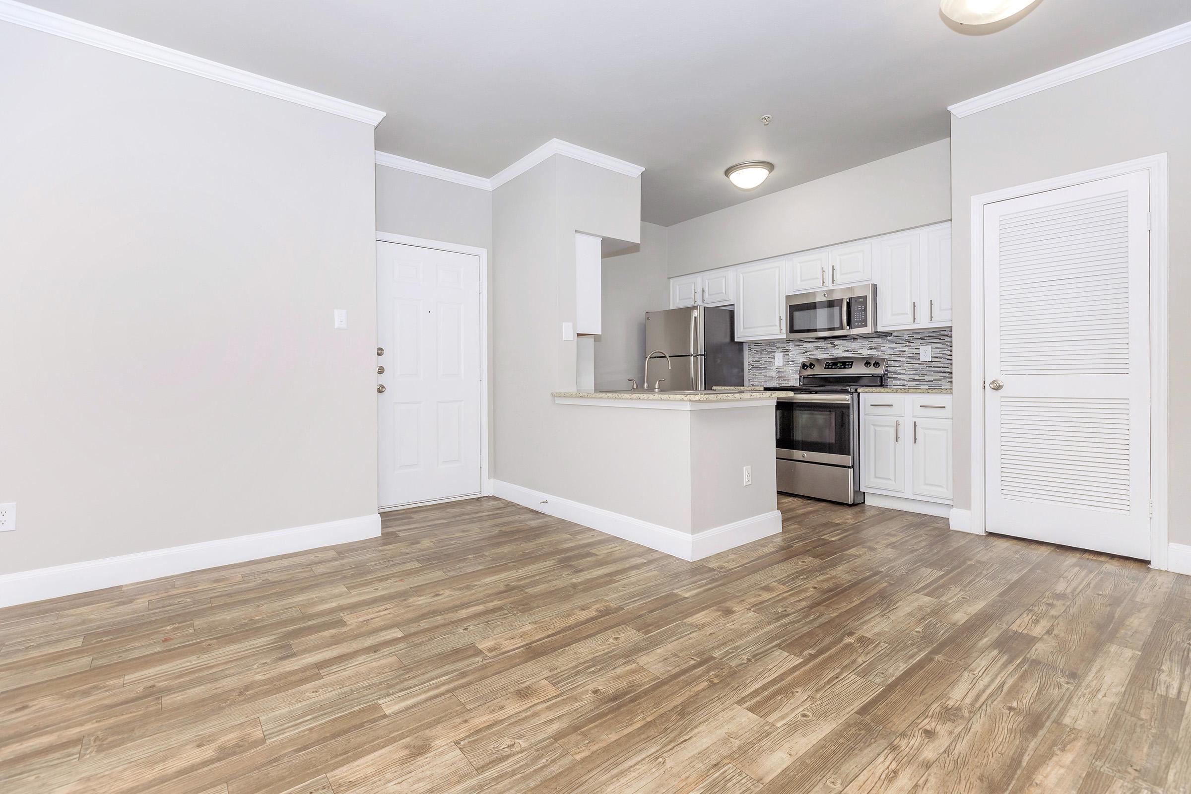 a kitchen with a wooden floor