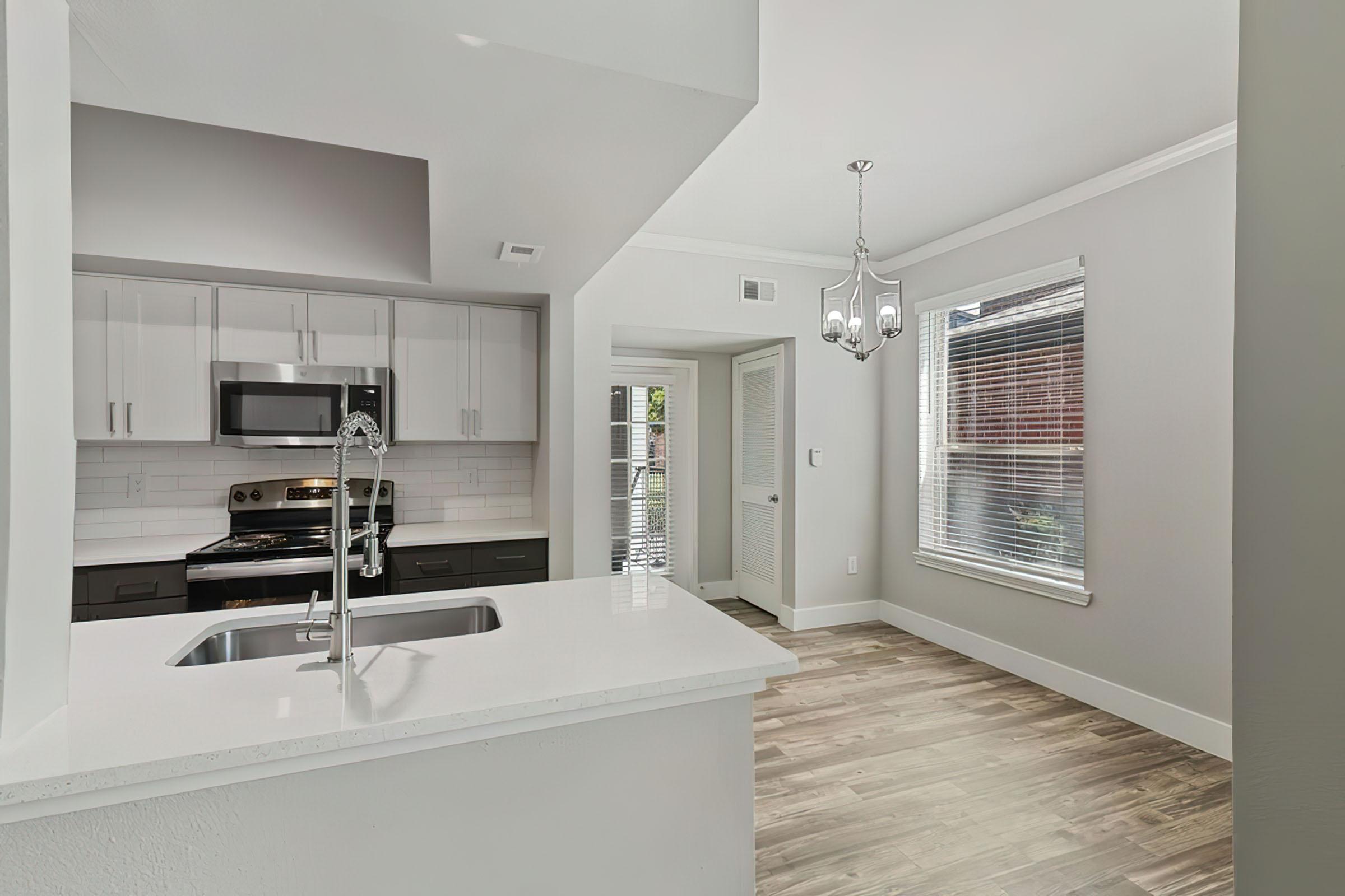 a kitchen with a sink and a window