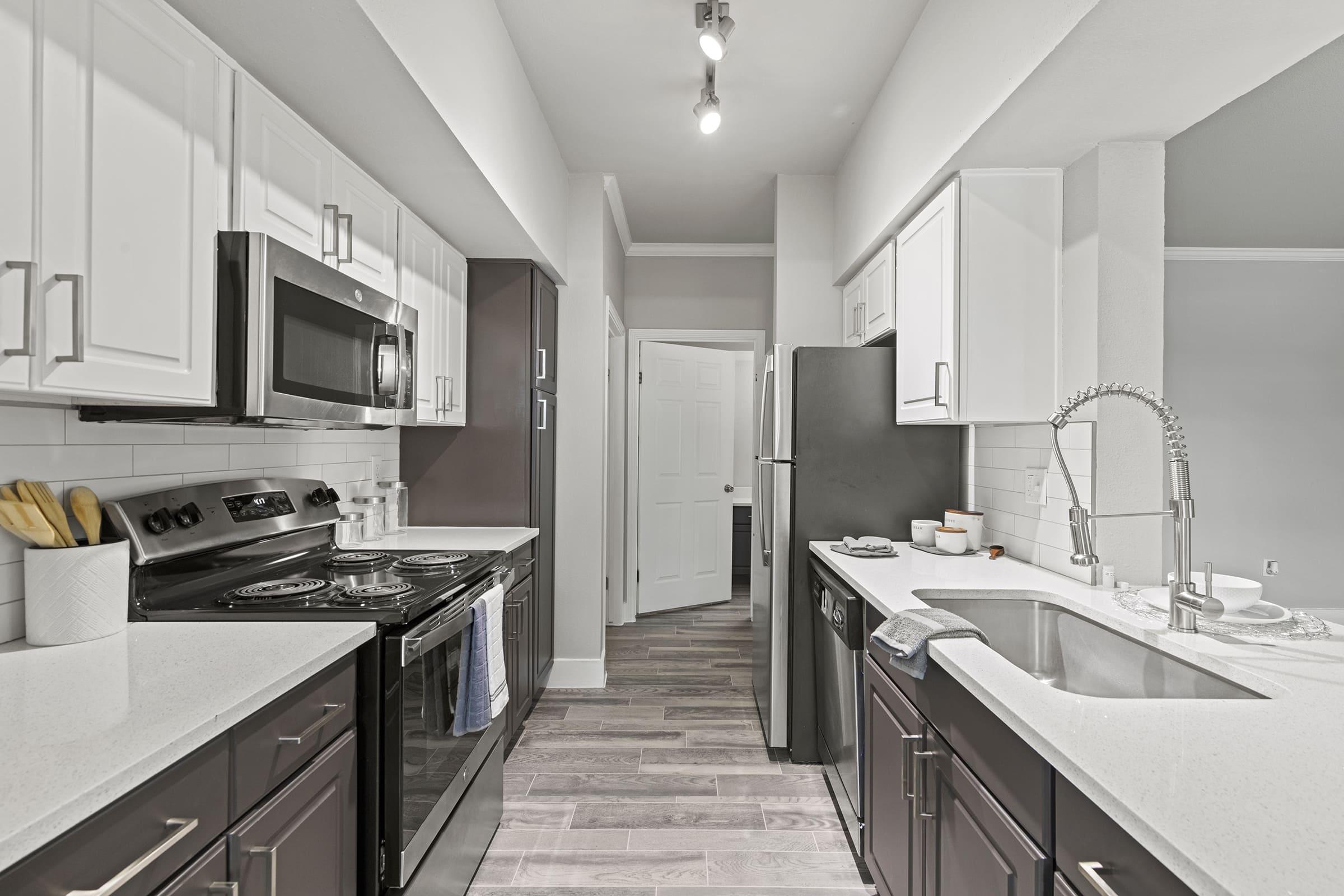 a kitchen with a stove and a sink