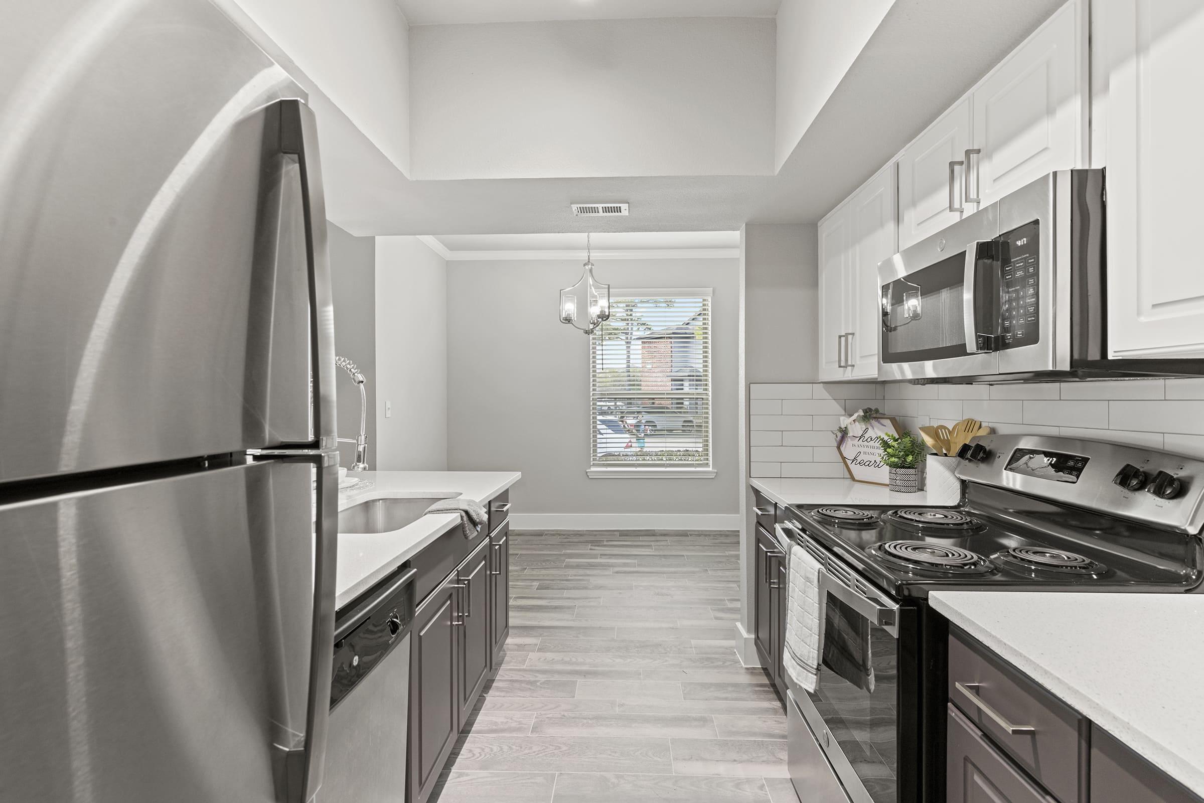 a modern kitchen with stainless steel appliances