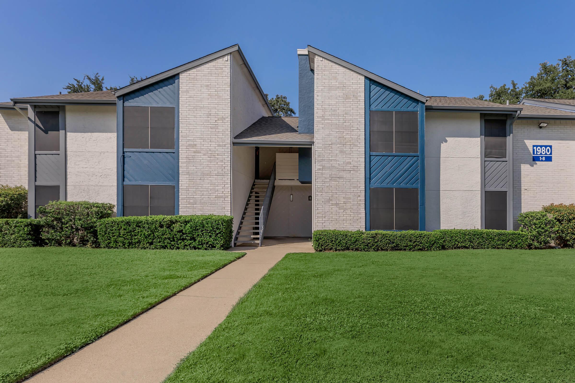 Large green space in front of the apartments at Rise Oak Creek.