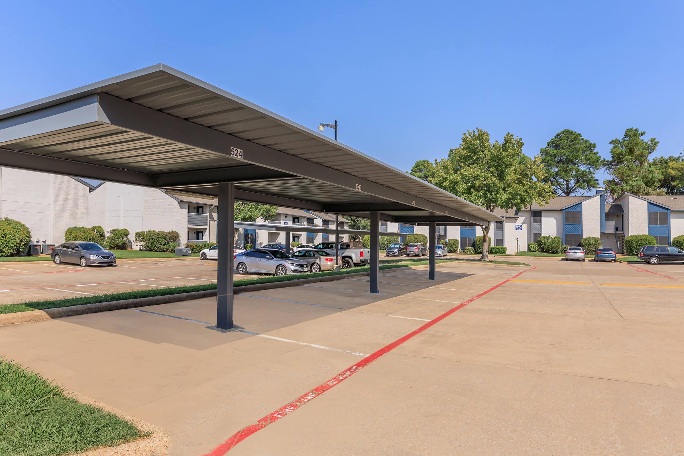 The covered parking area of at Rise Oak Creek.