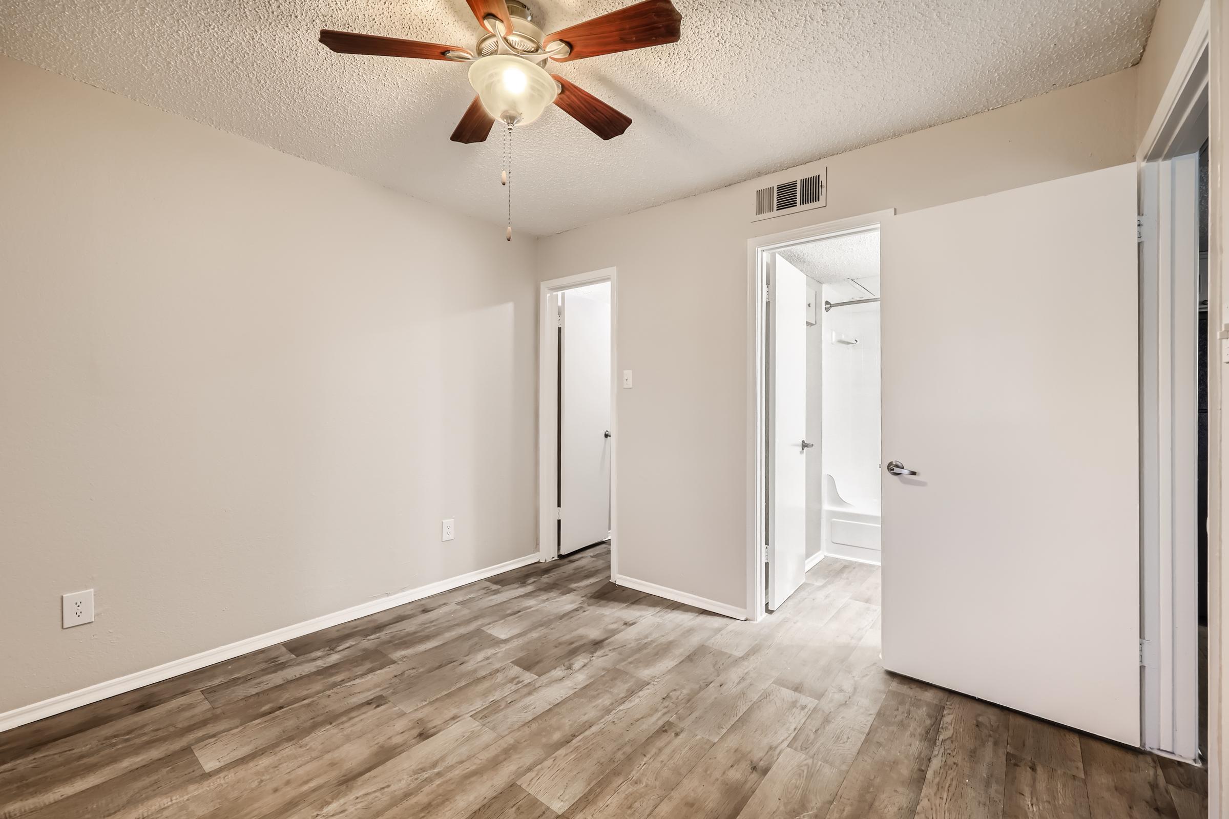 a kitchen with a wood floor