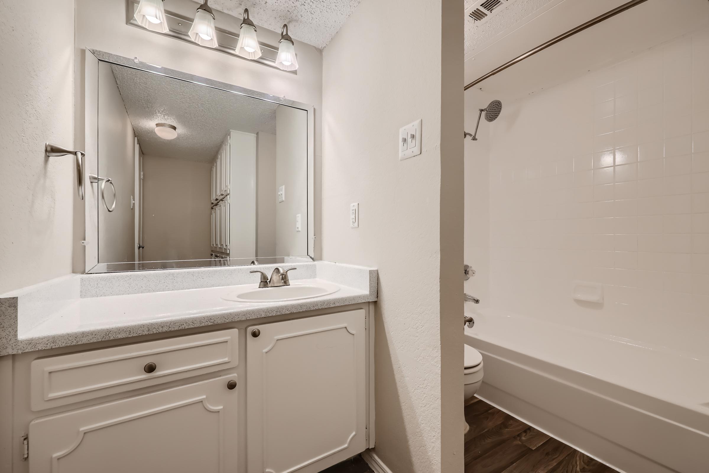 A bathroom with a separated shower and toilet at Rise Oak Creek.