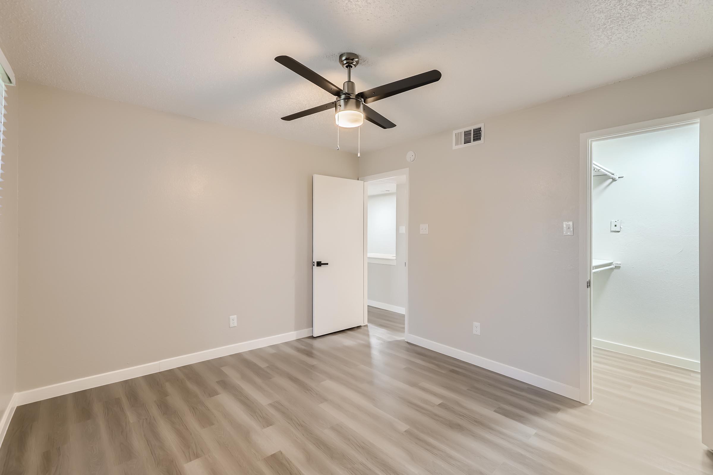 a large empty room with a wood floor