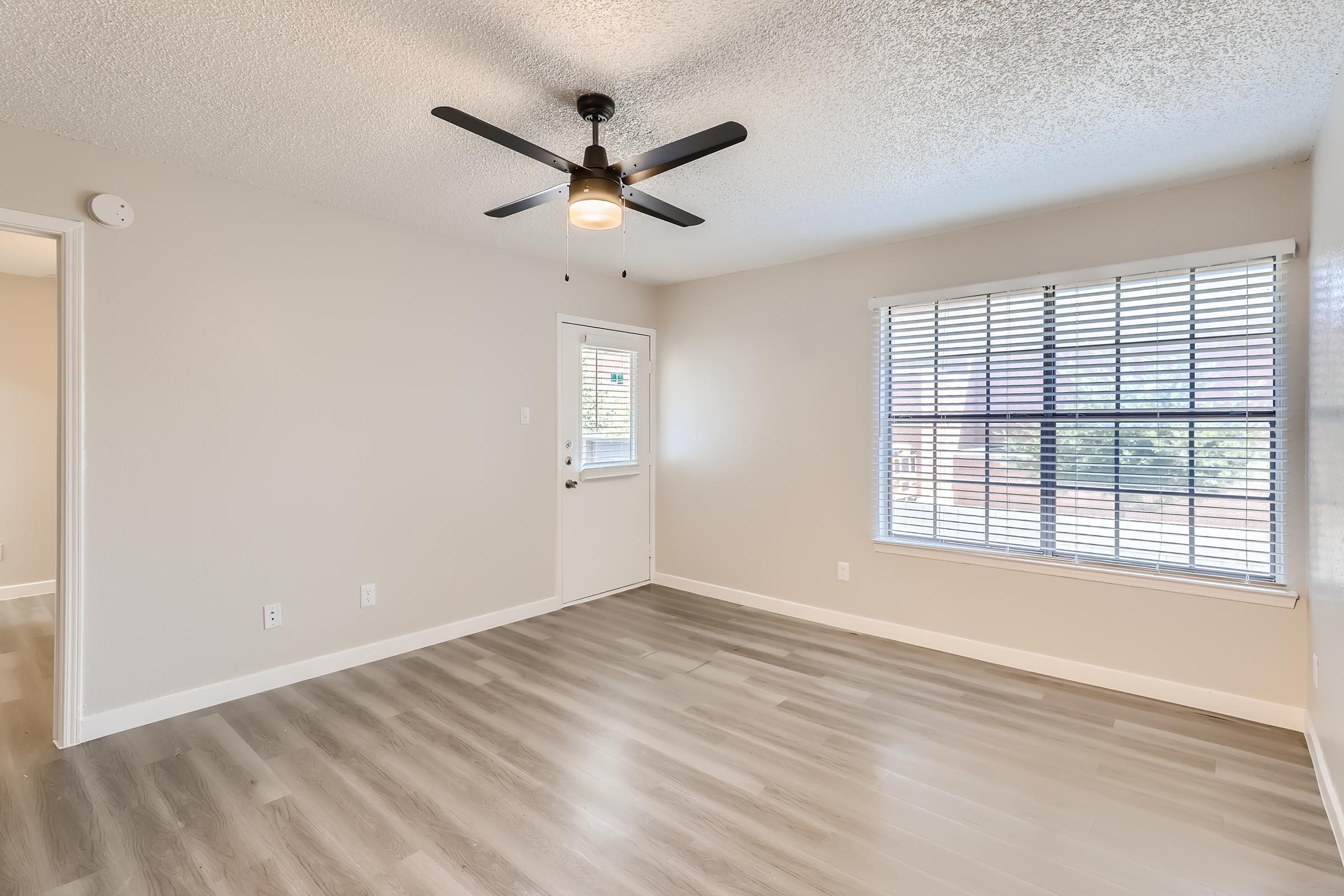 a room filled with furniture and a large window