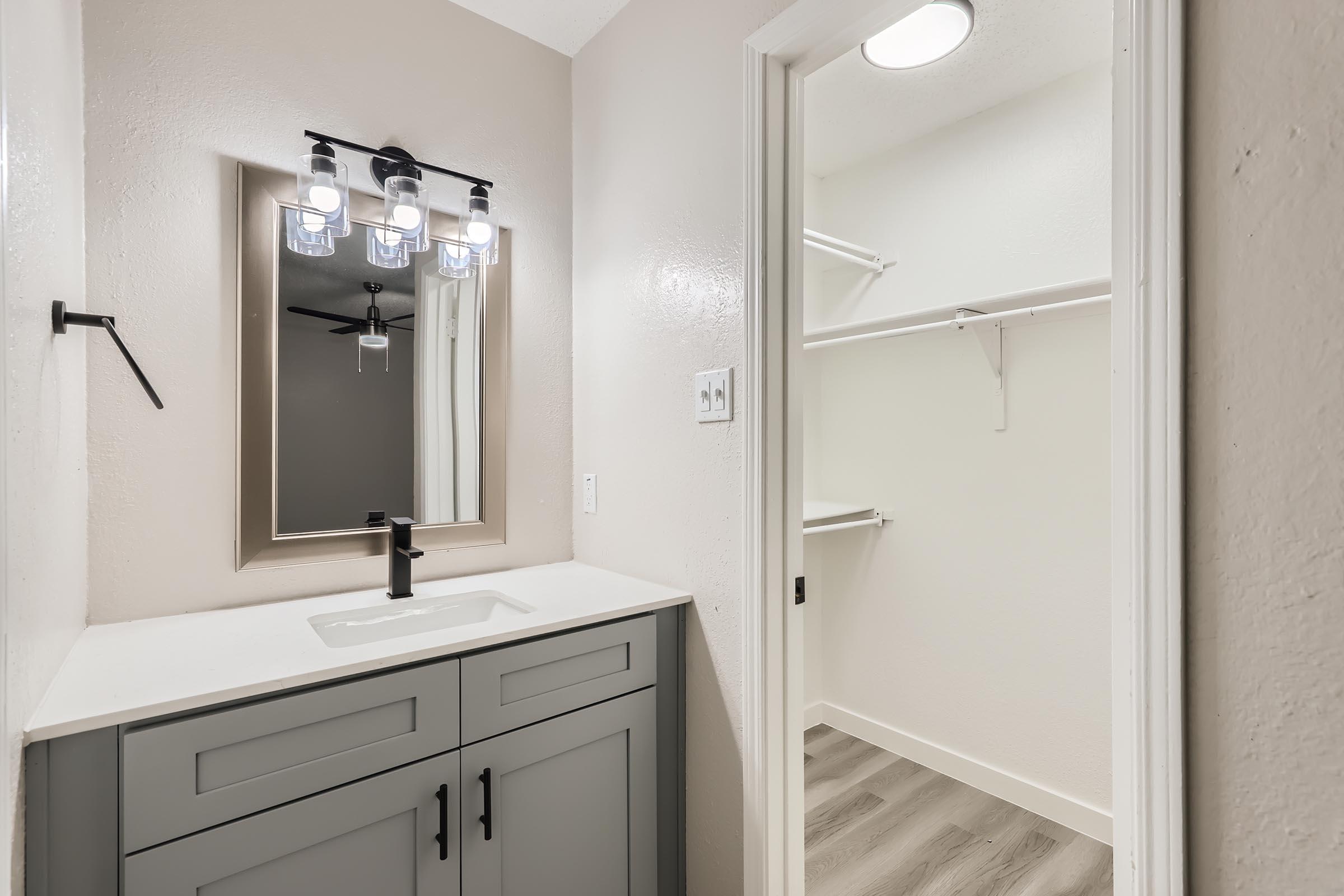 A remodeled bathroom with a separate toilet area at Rise Oak Creek.