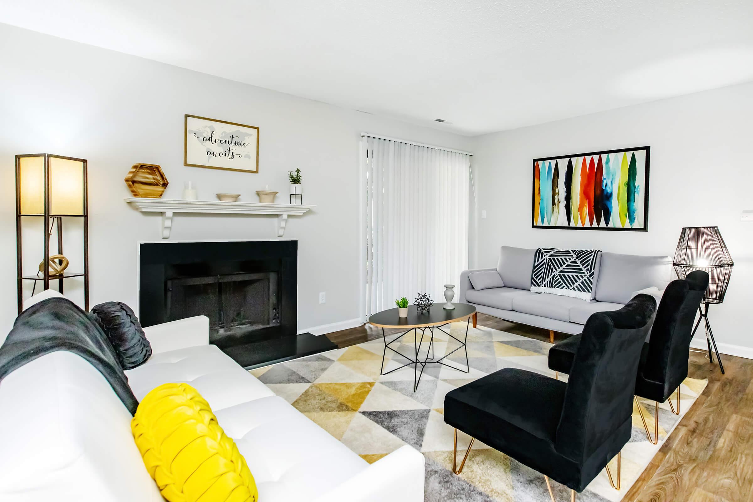 a living room filled with furniture and a flat screen tv