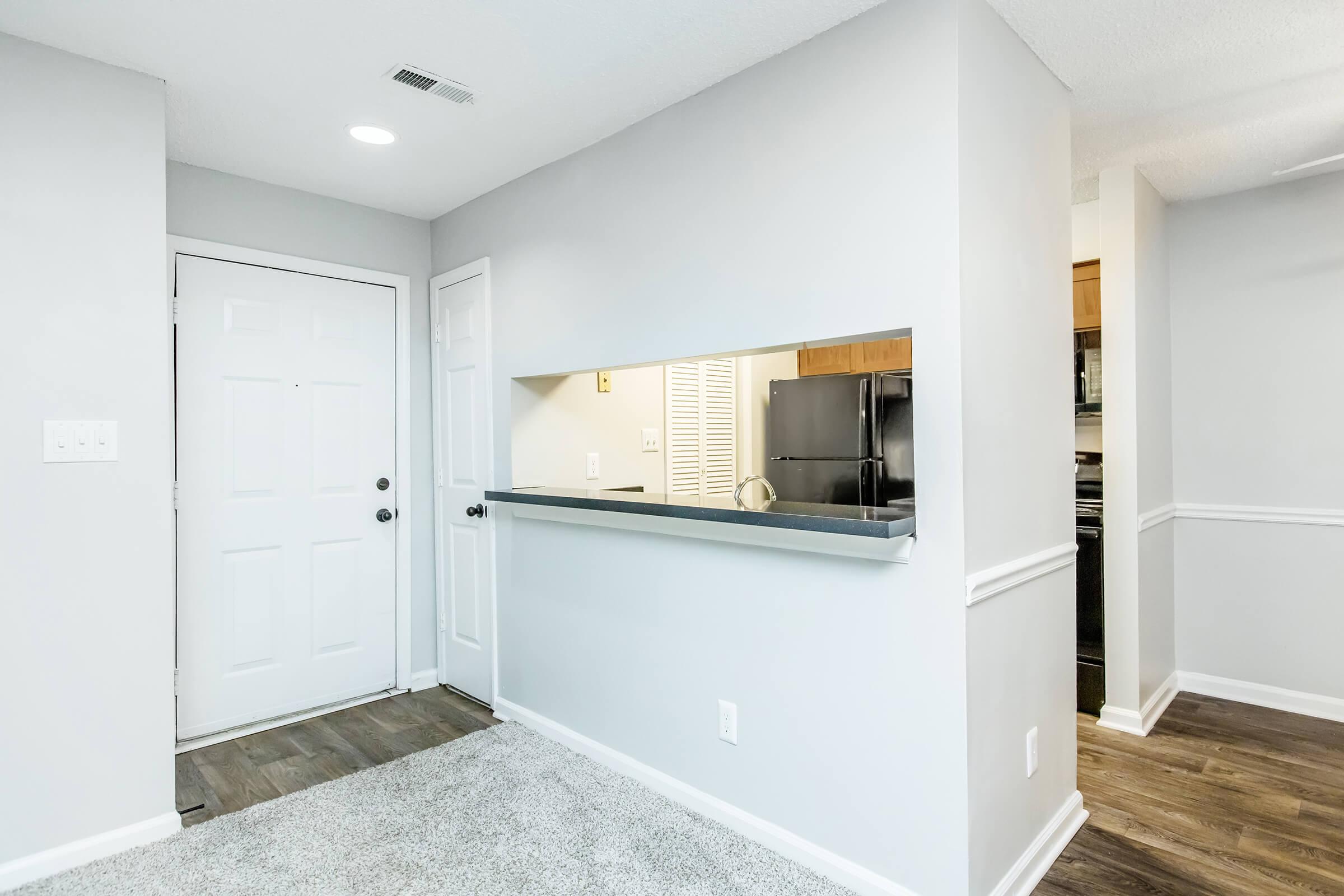 a kitchen with a sink and a refrigerator