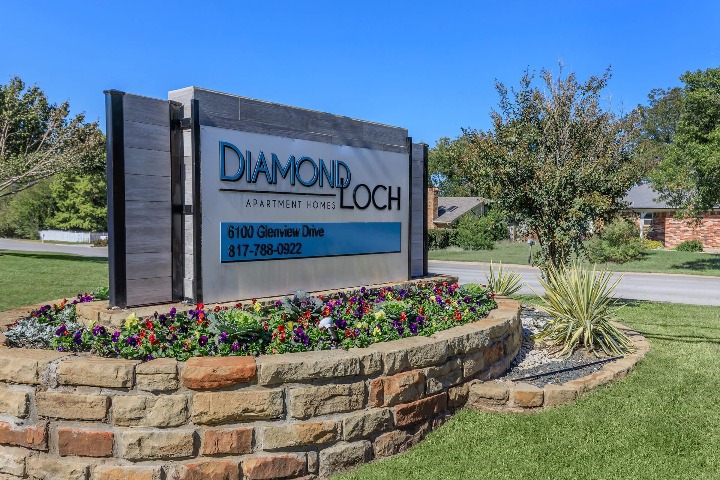 a sign in front of a brick building