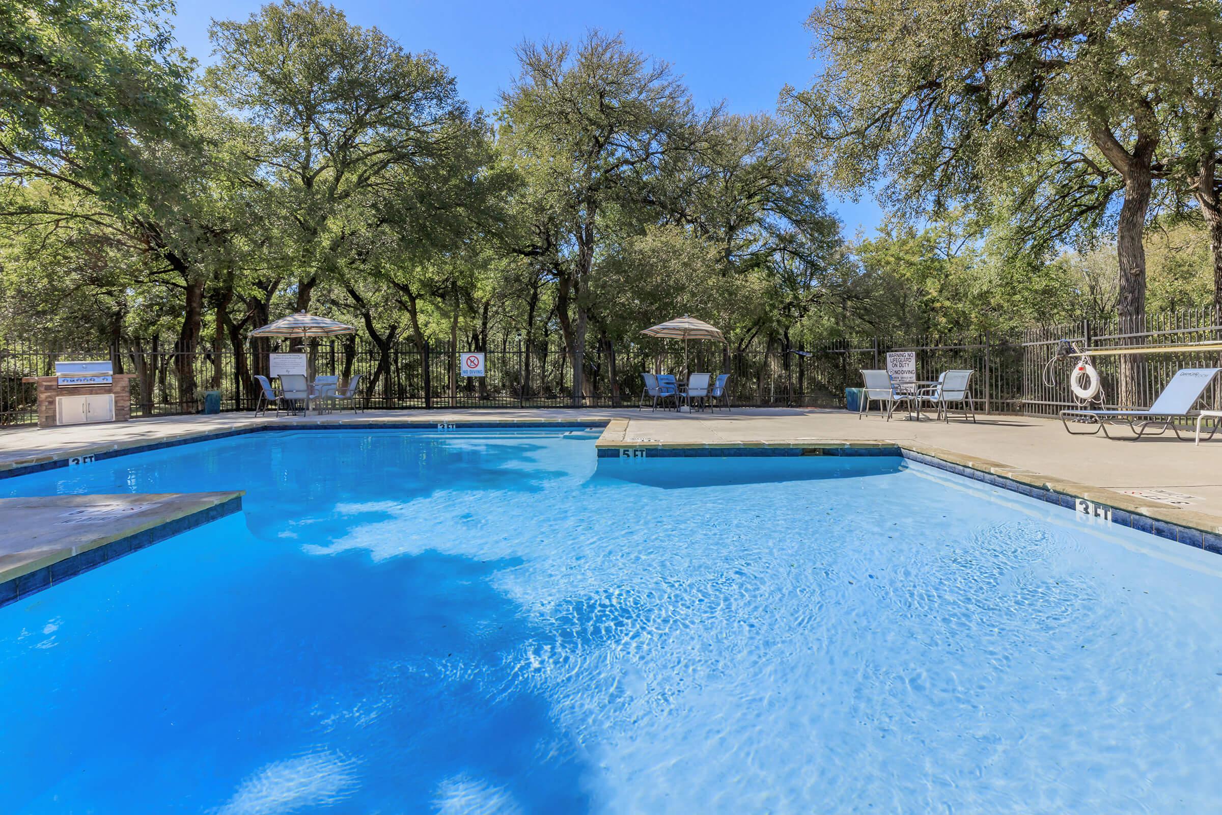 a pool next to a body of water