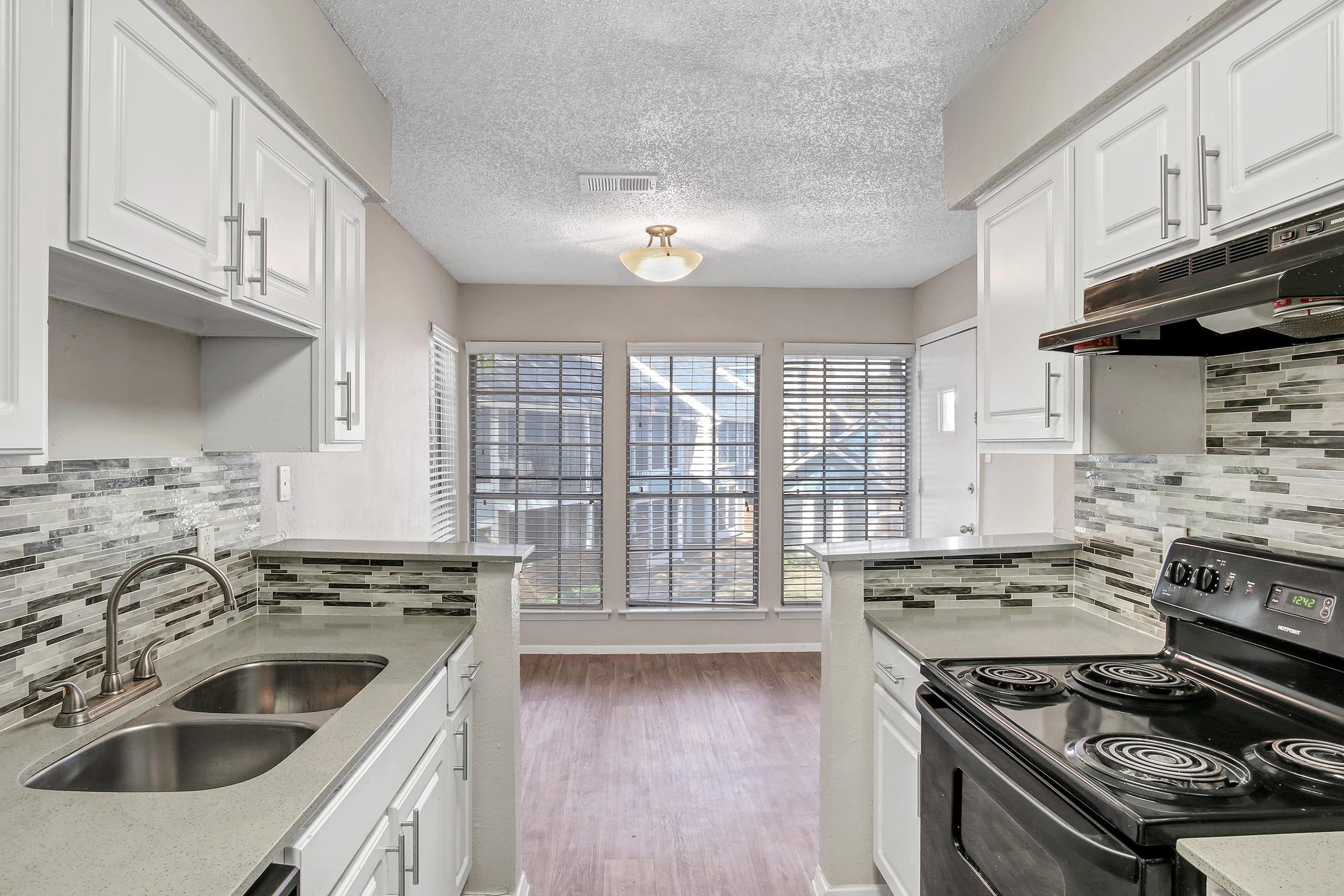 a kitchen with a stove top oven