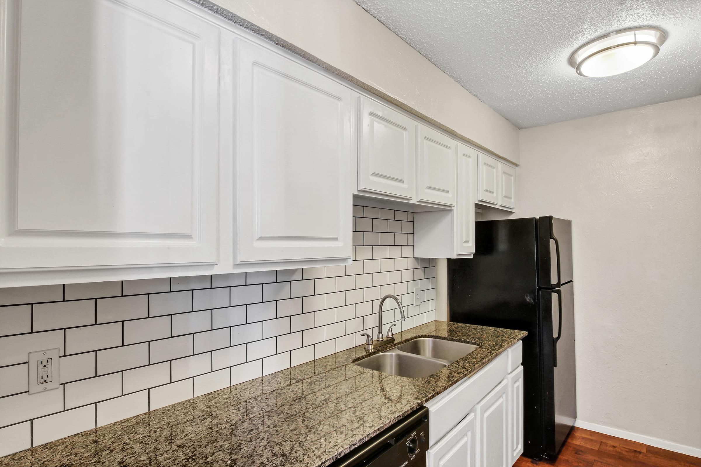 a kitchen with a stove and a sink