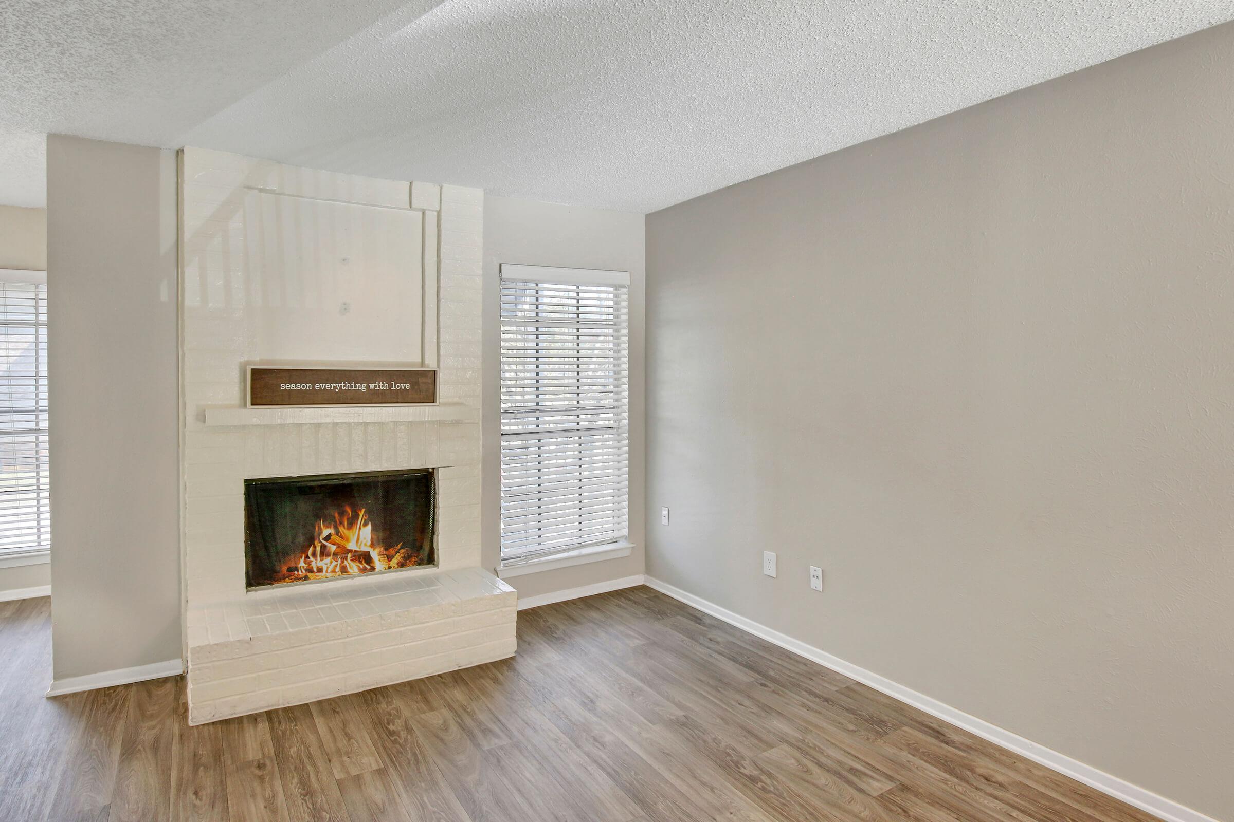 a room filled with furniture and a fireplace