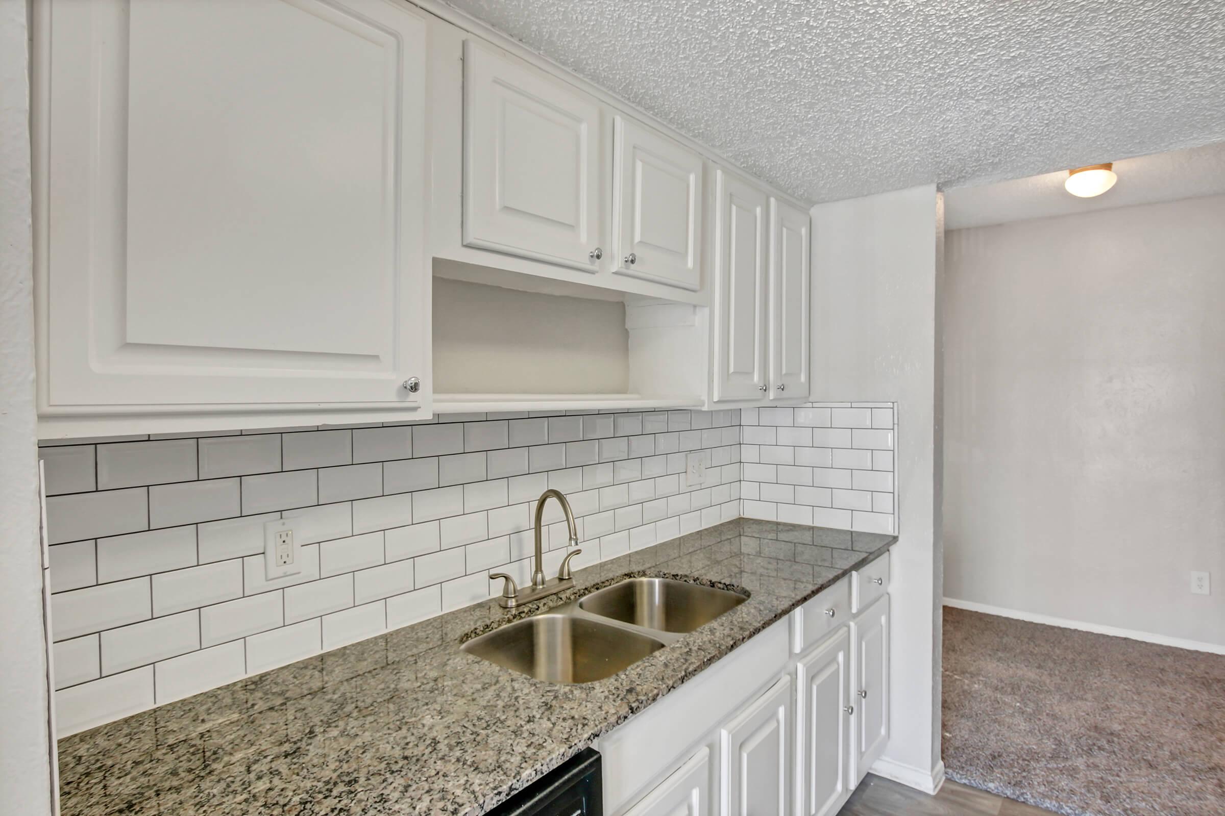 a kitchen with a sink and a window