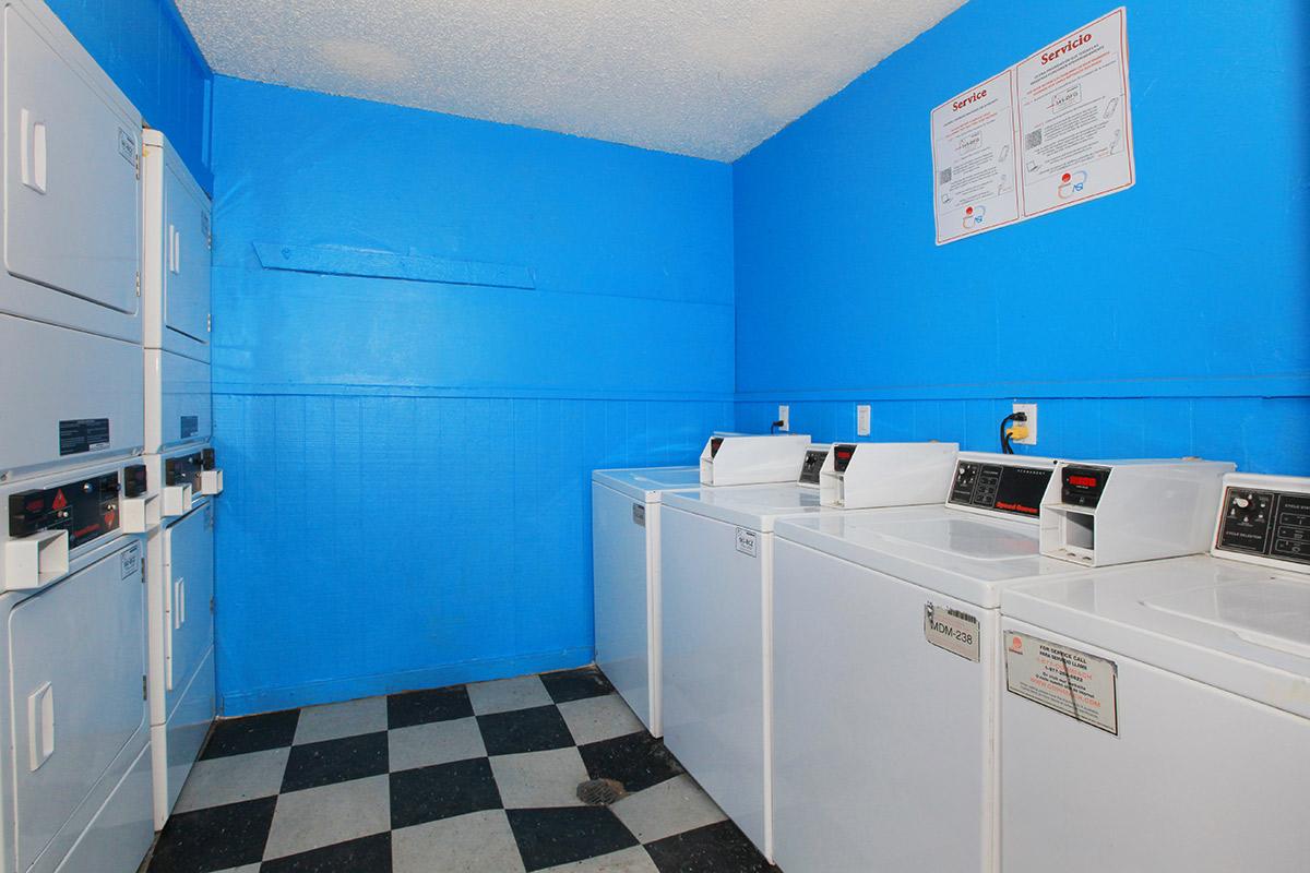 a kitchen with a blue and white tile