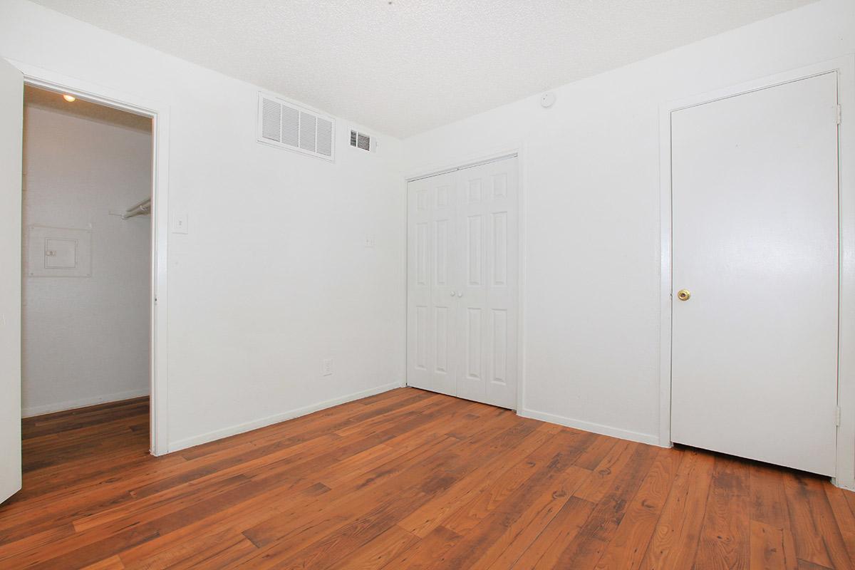 a kitchen with a wood floor