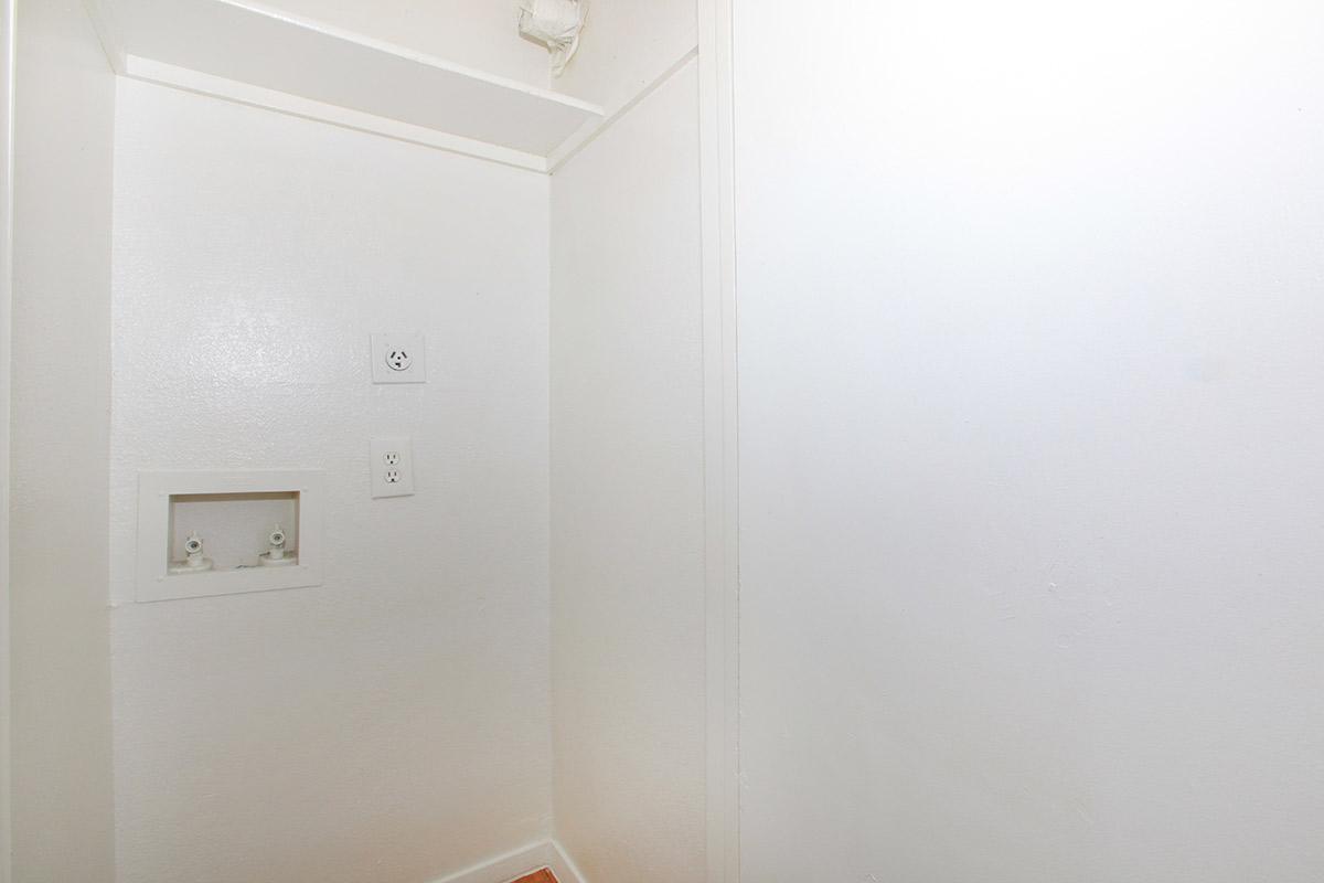 a white refrigerator freezer sitting in a room