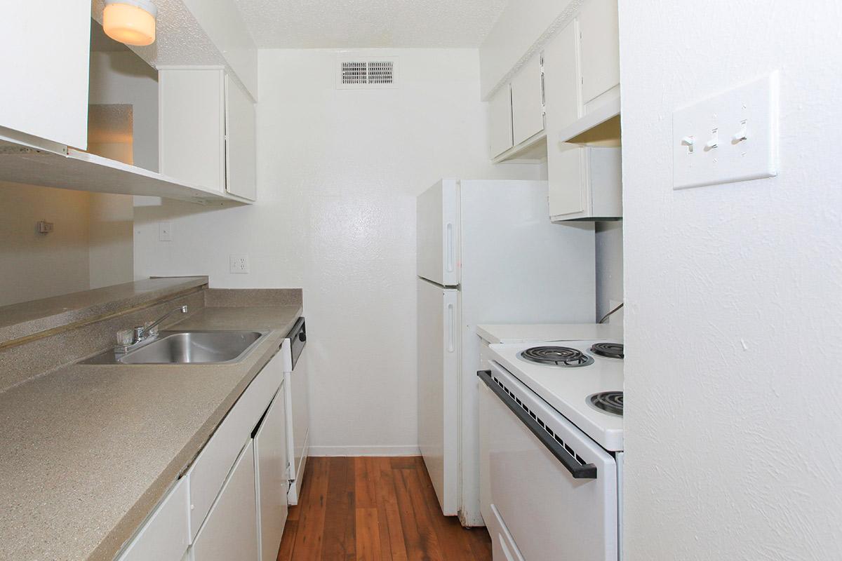 a kitchen with a stove top oven sitting inside of a refrigerator