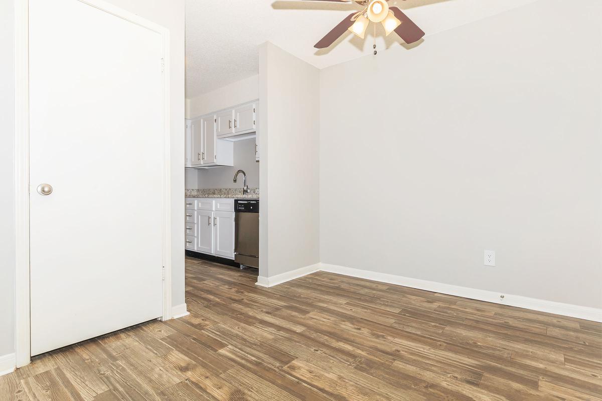 Vinyl wood floored dining area with ceiling fan in Nashville, TN.