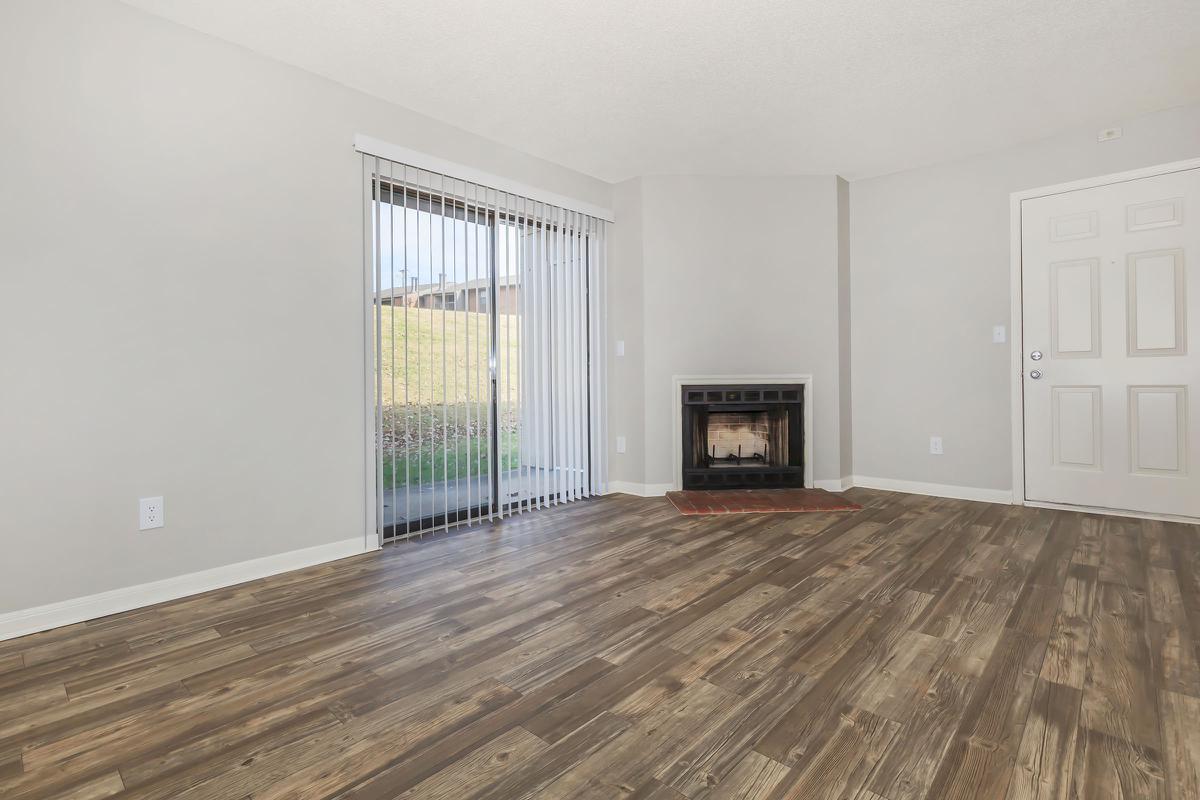 	Wood floors with sliding doors and fireplace in one bedroom apartment in Nashville, TN