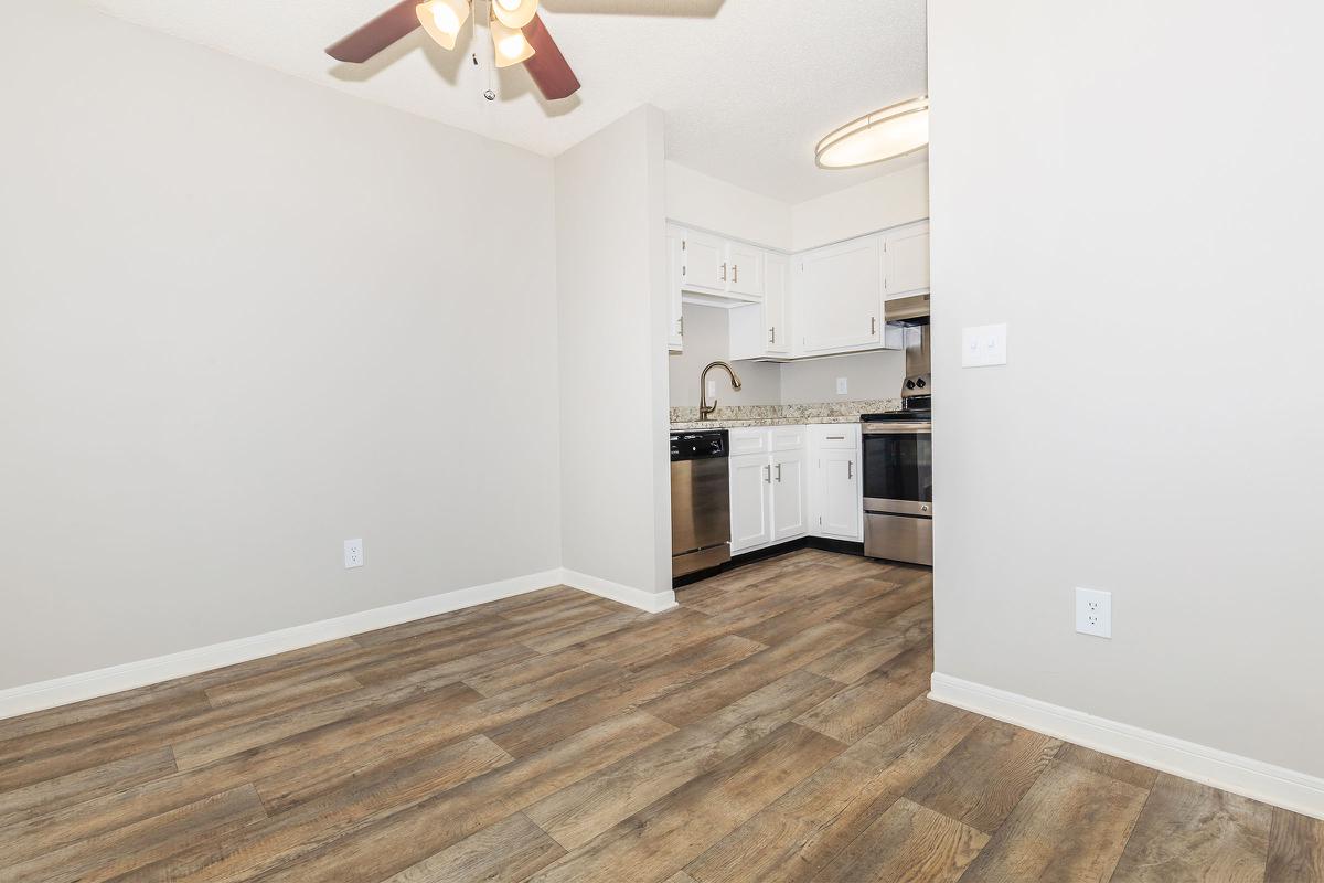Ceiling fan above dining area with vinyl wood flooring