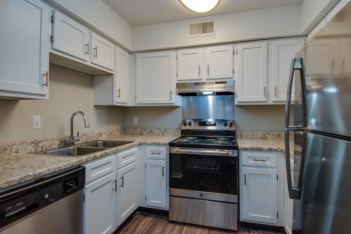 Kitchen with modern stainless steel appliances and beautiful countertops