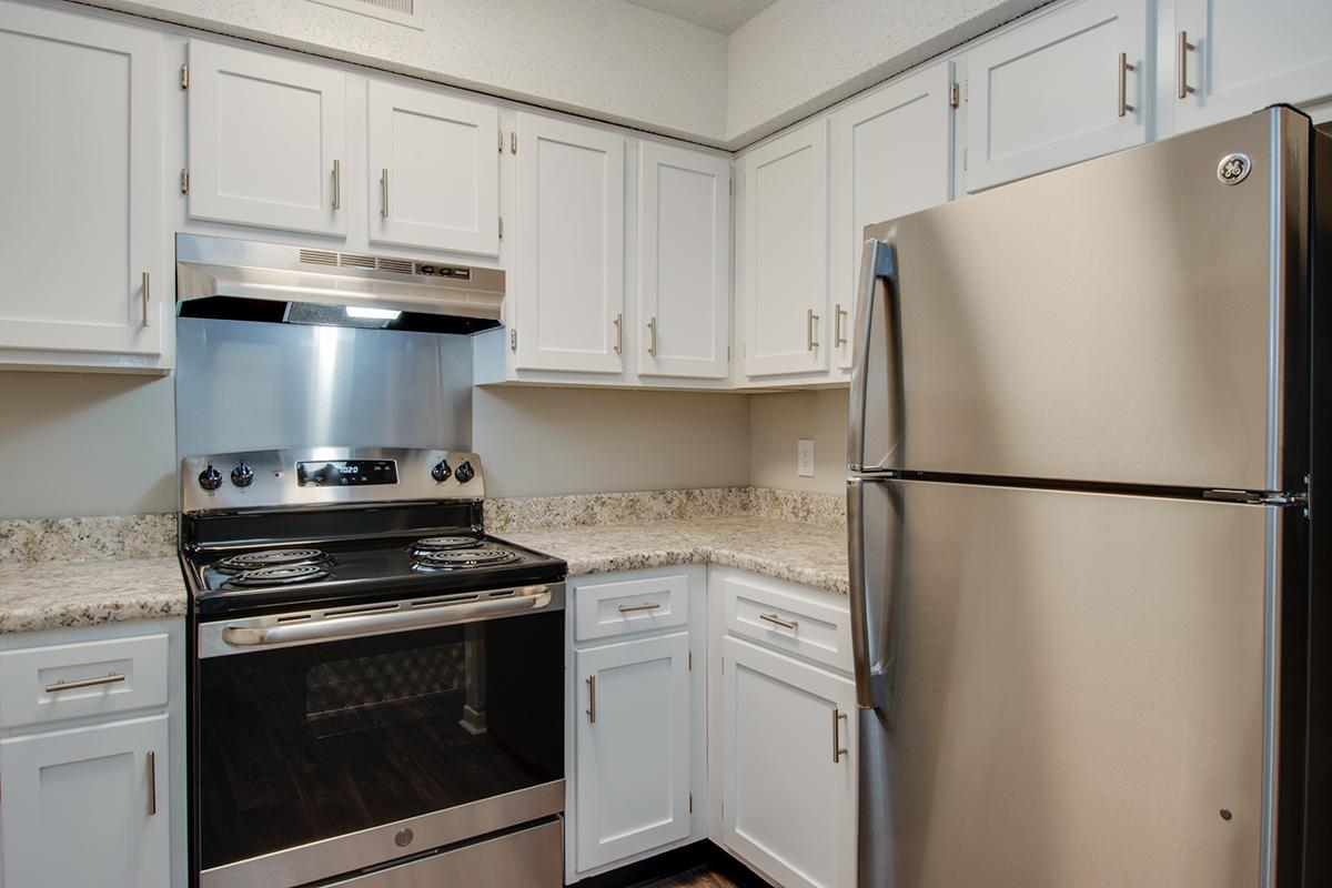 Modern kitchen with stainless steel appliances at Hillhurst Apartments in Nashville, Tennessee.