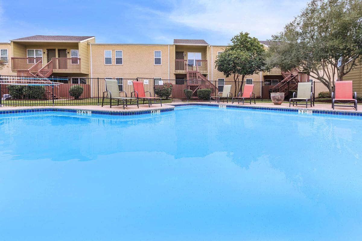a large pool of water in front of a building