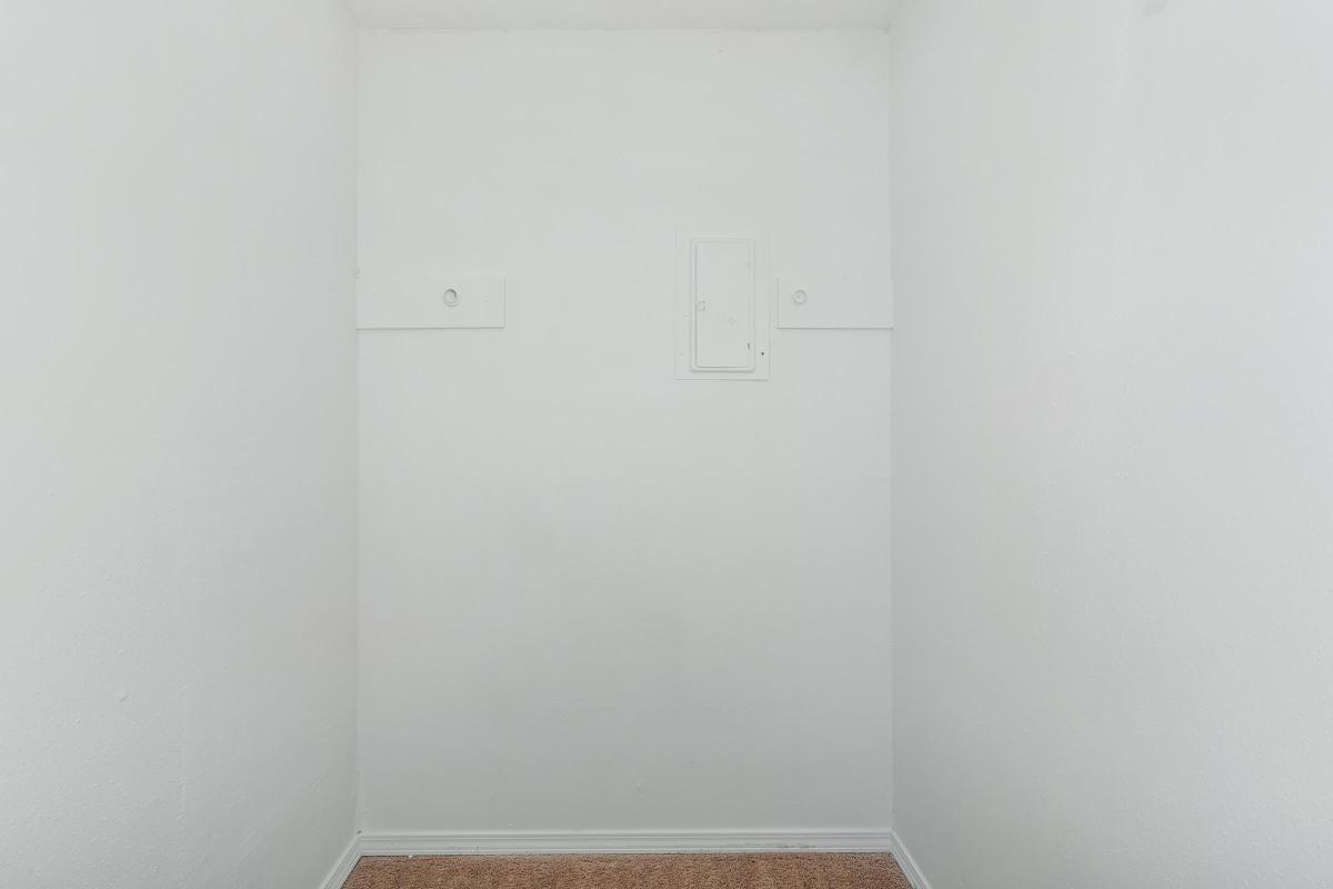 a white refrigerator freezer sitting next to a door