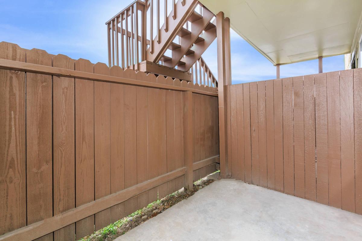 a kitchen with a wooden fence