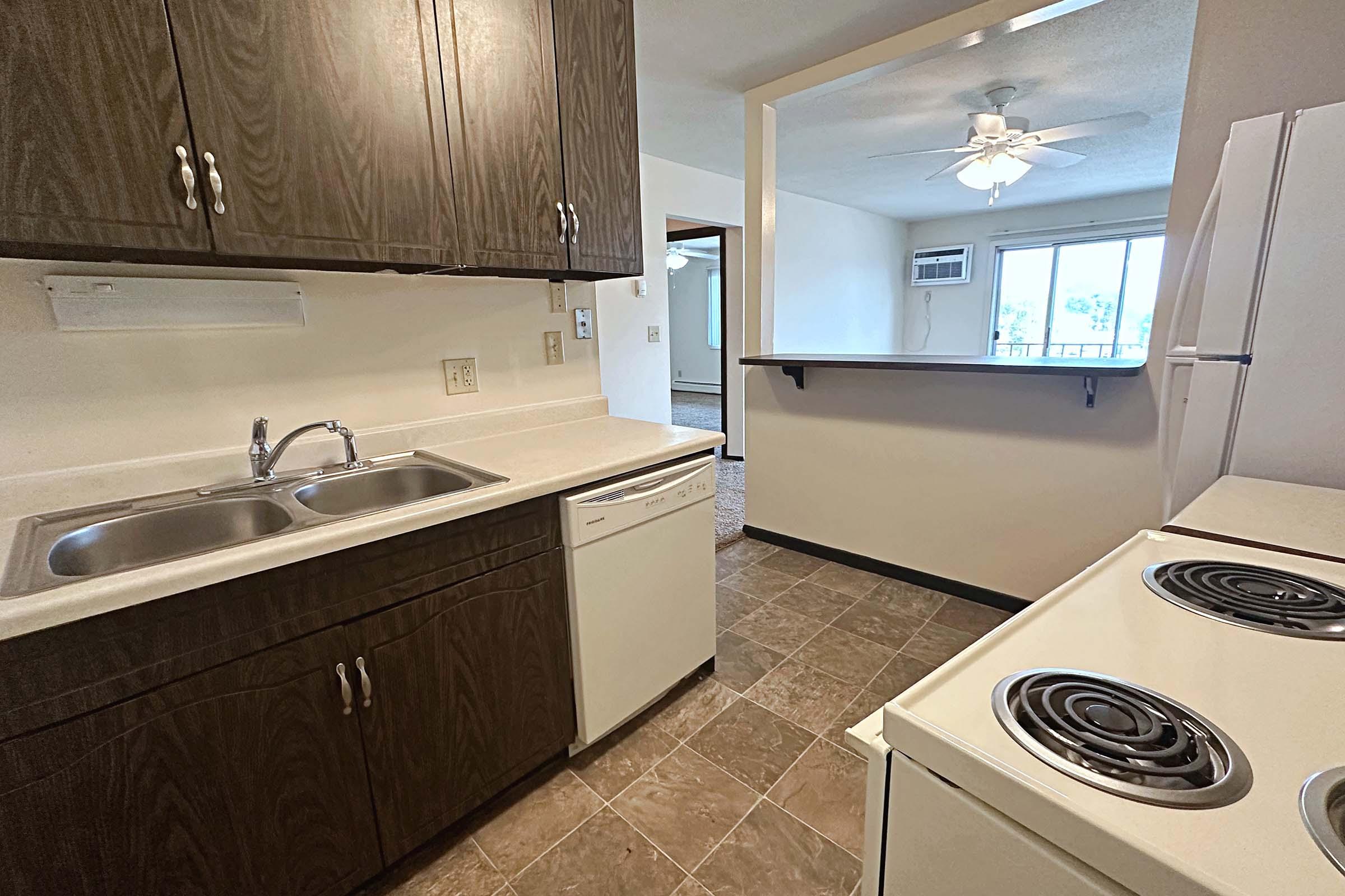 a kitchen with a stove a sink and a microwave