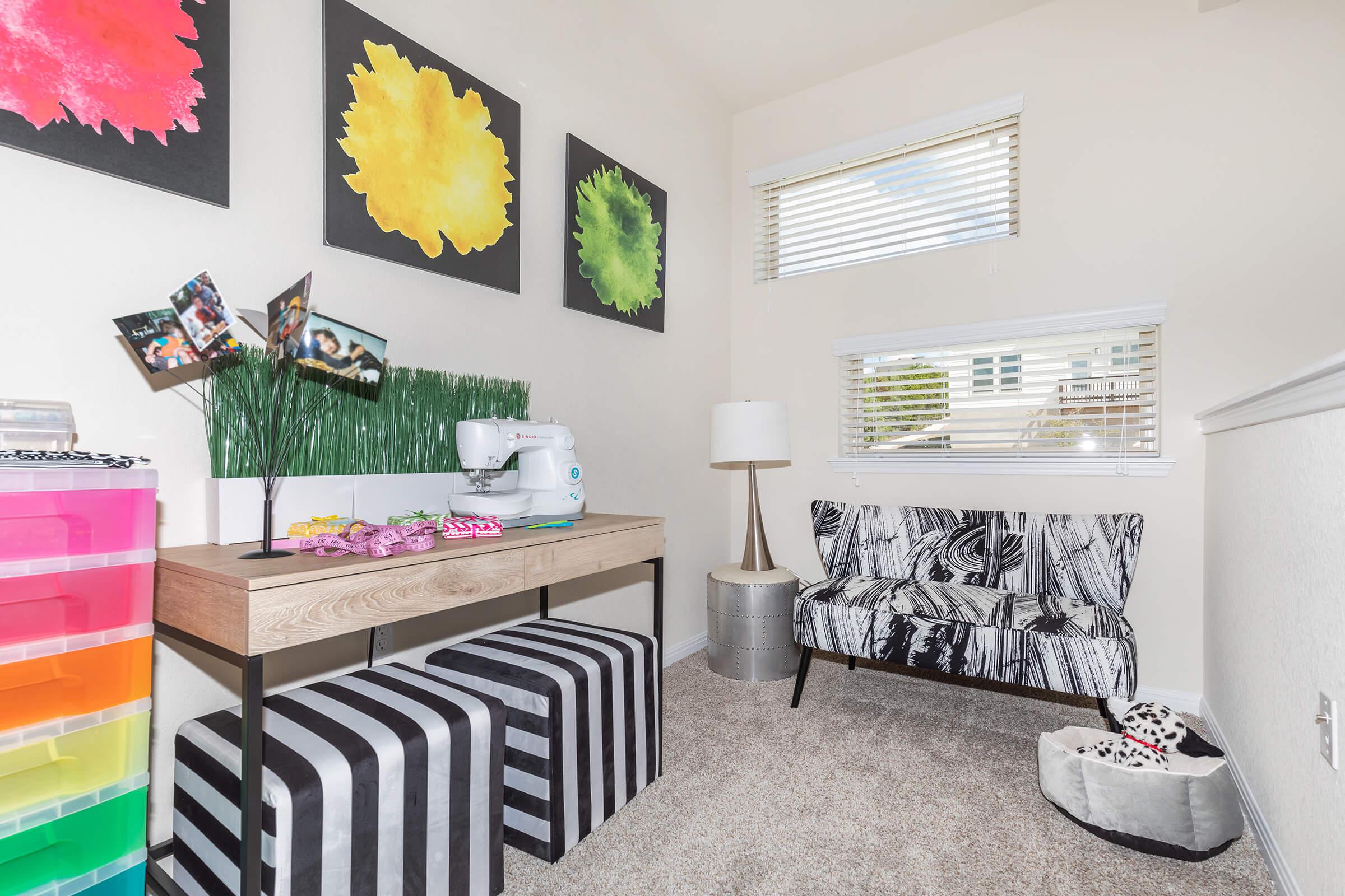 a living room filled with furniture and a tv