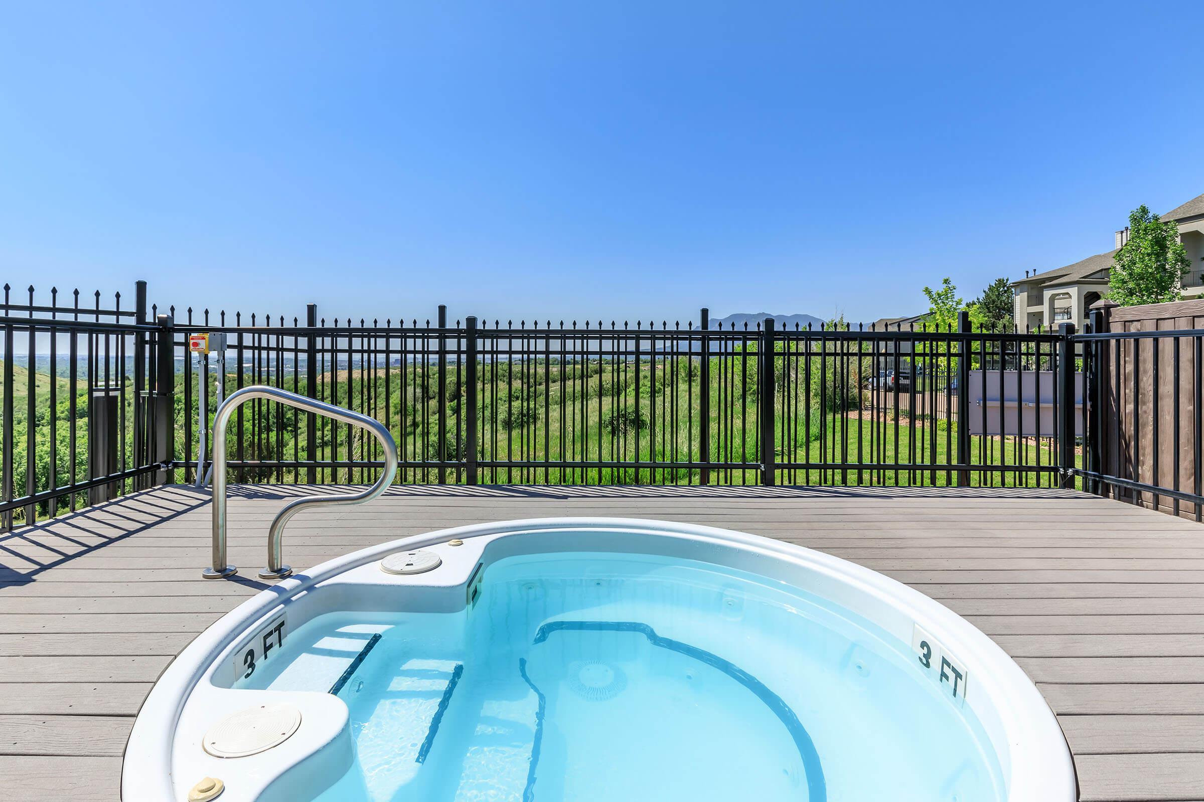 a pool next to a fence