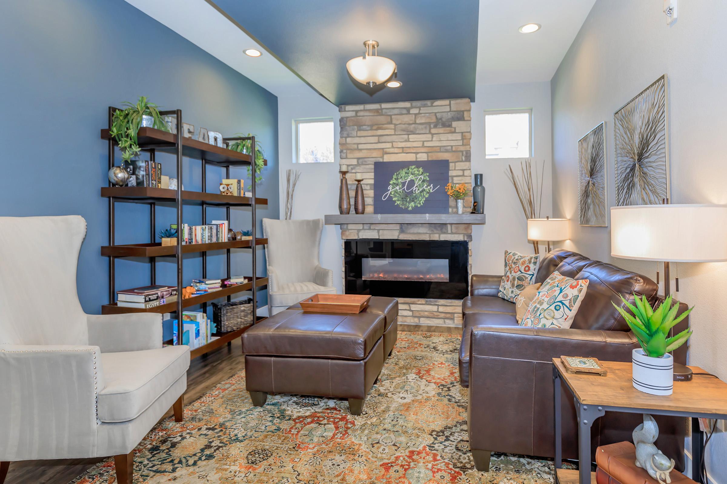 a living room filled with furniture and a fire place