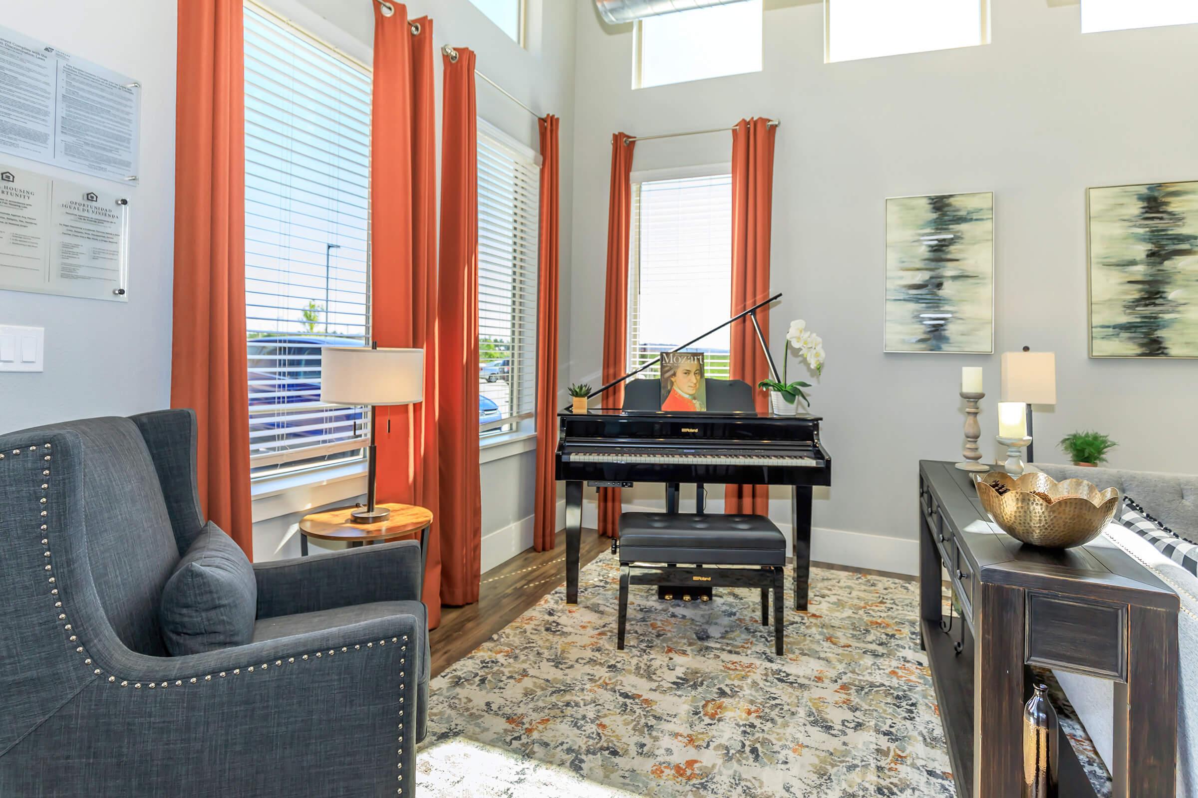 a living room filled with furniture and a large window