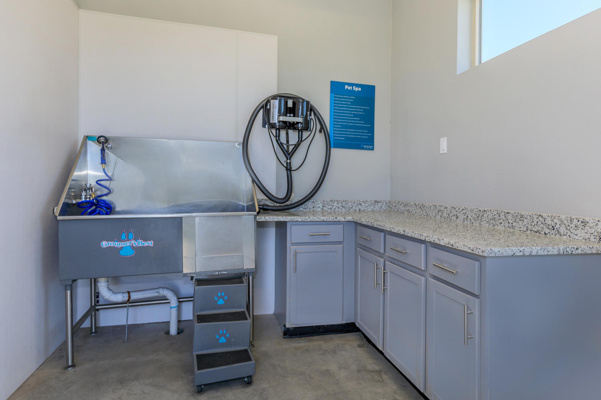 a stove top oven sitting inside of a kitchen