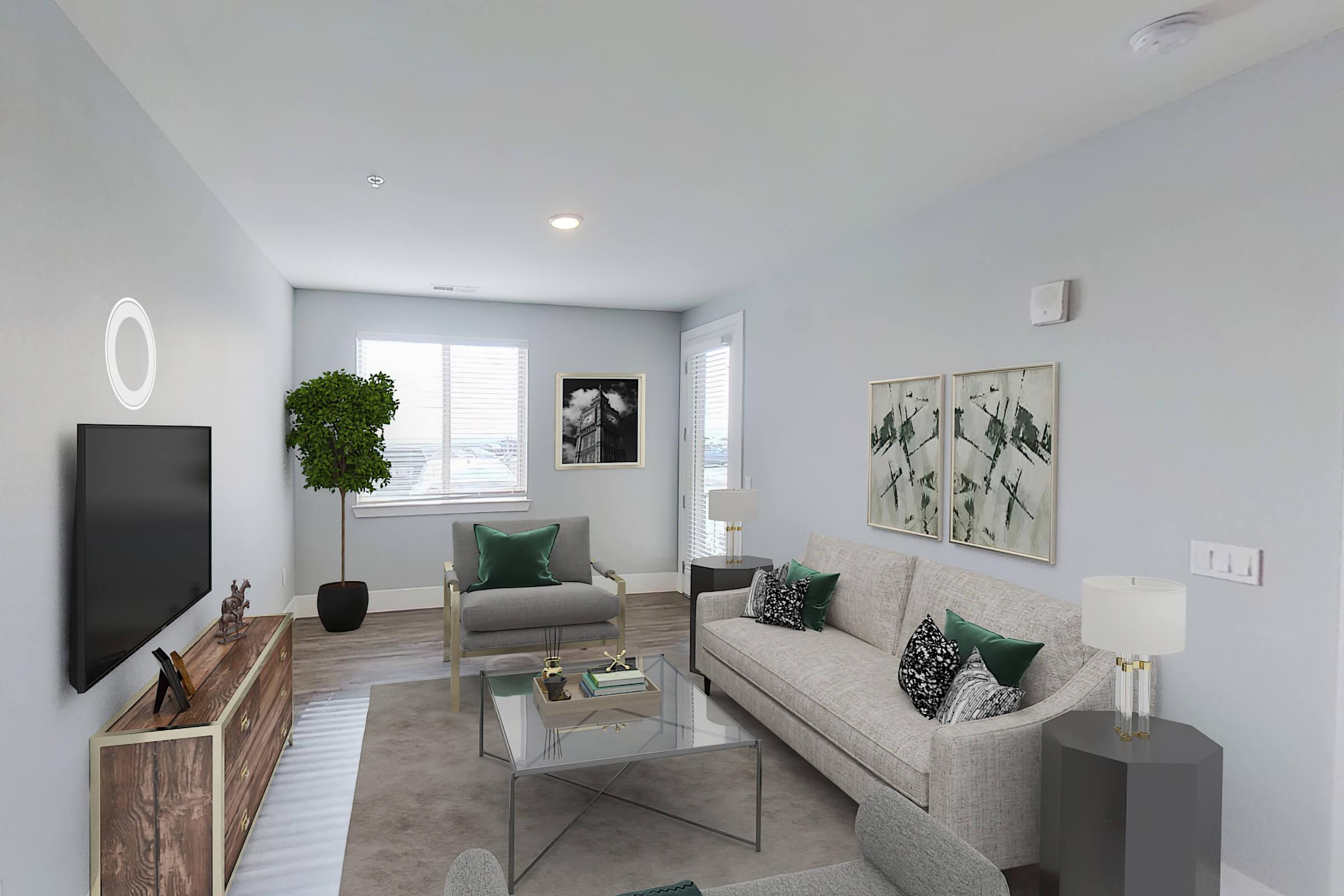 a living room filled with furniture and a flat screen tv