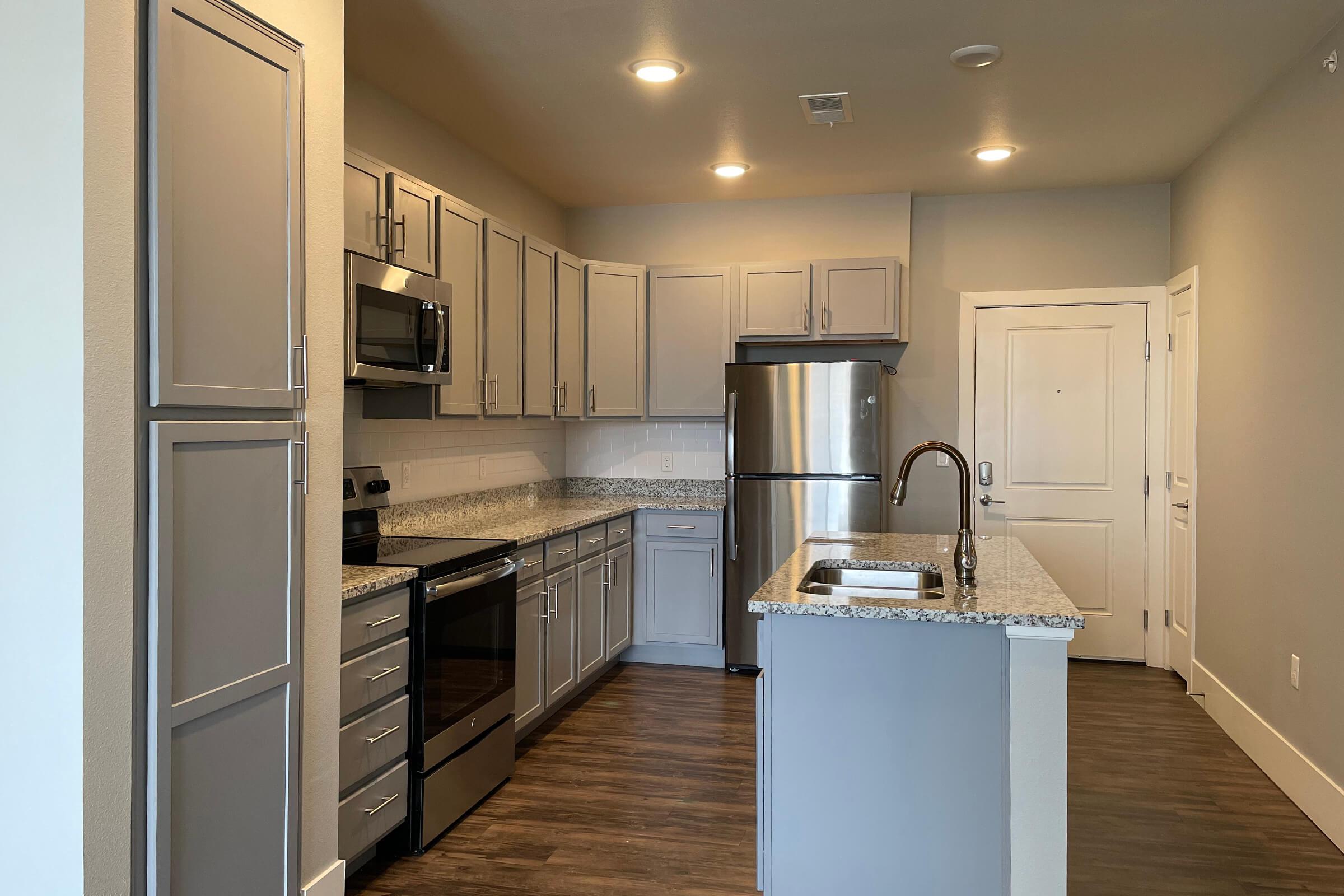 a stainless steel refrigerator in a kitchen