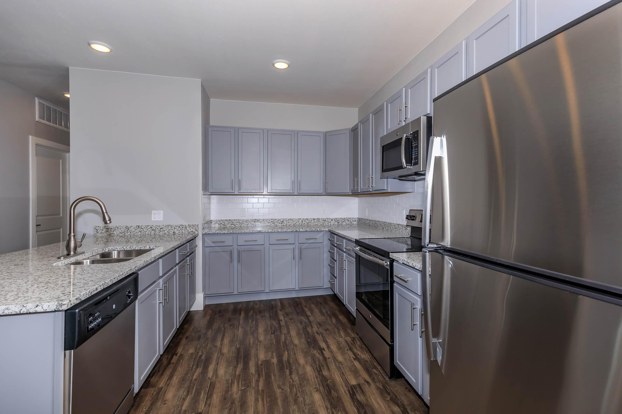 a stainless steel refrigerator in a kitchen