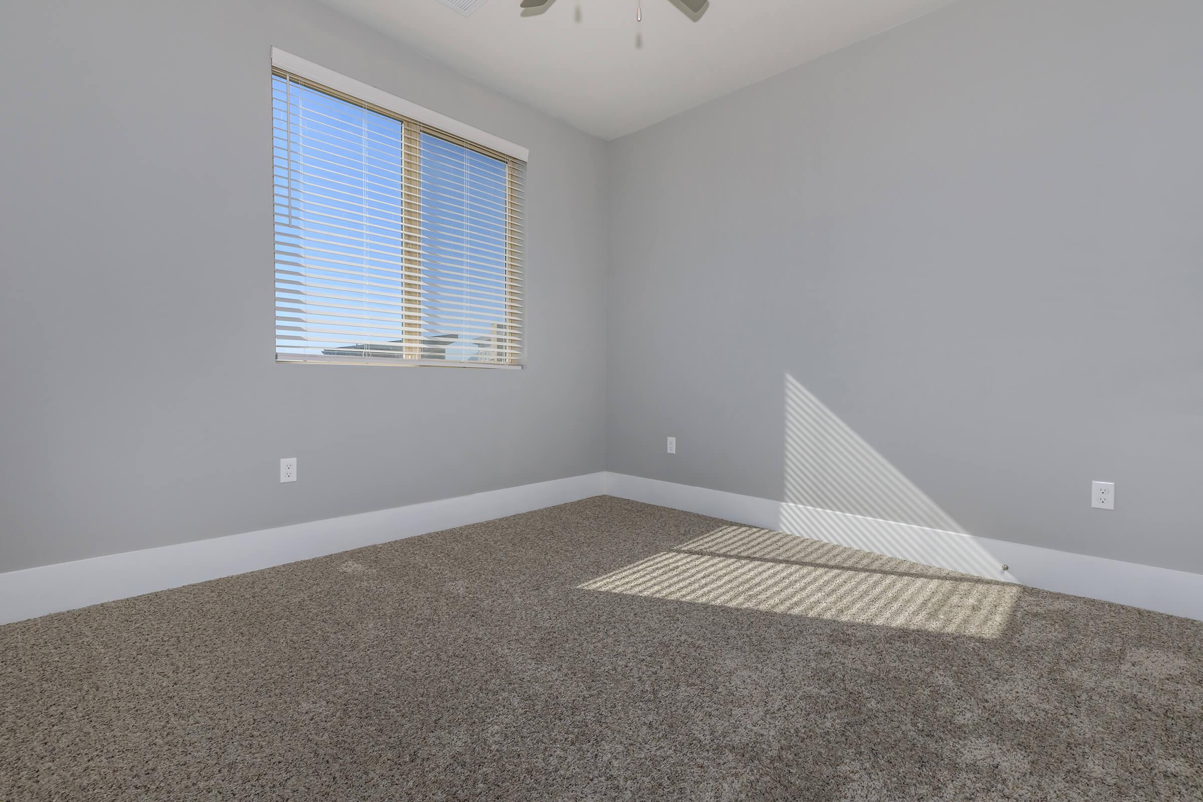 a bedroom with a large window