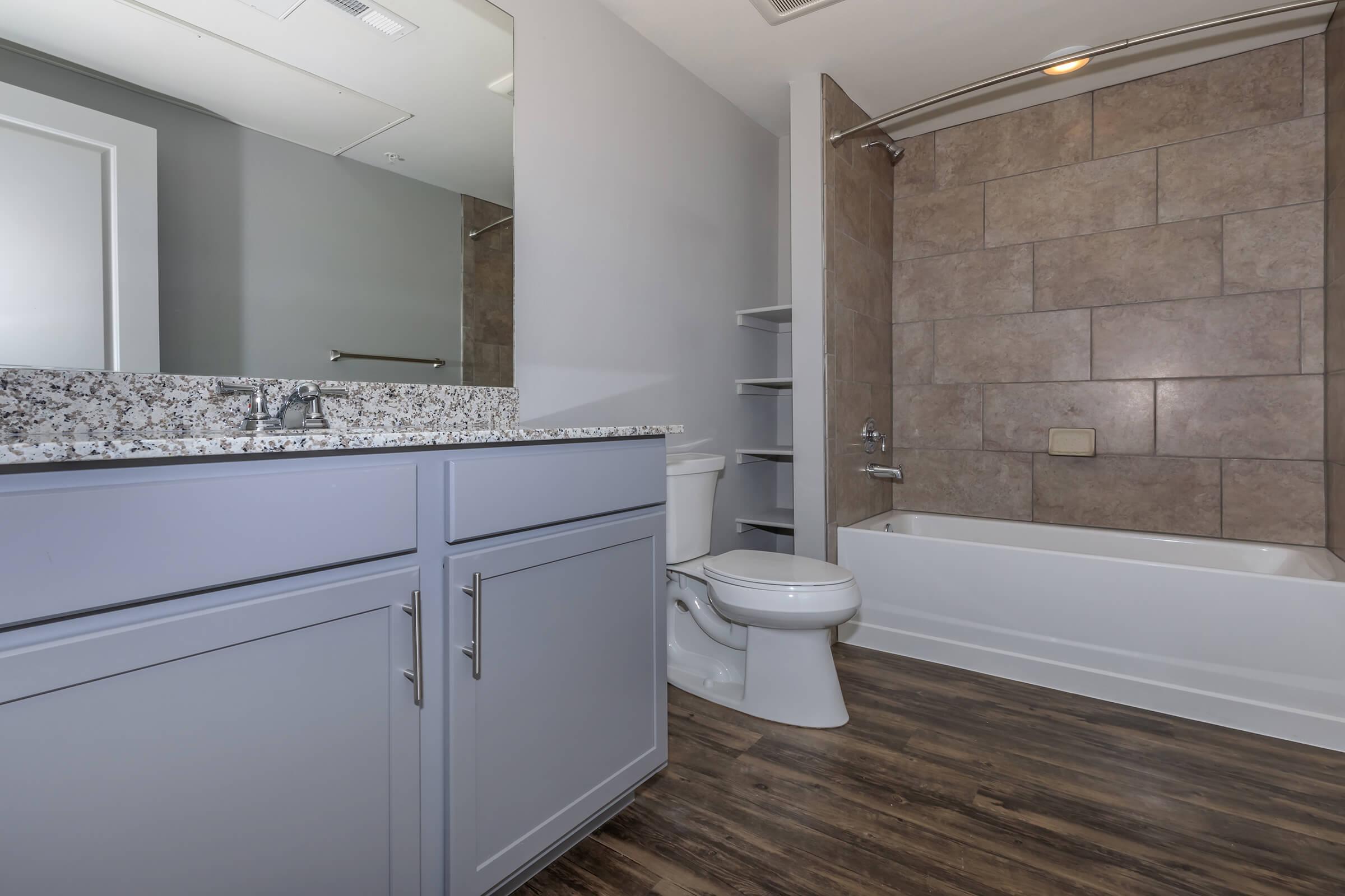 a kitchen with a sink and a shower