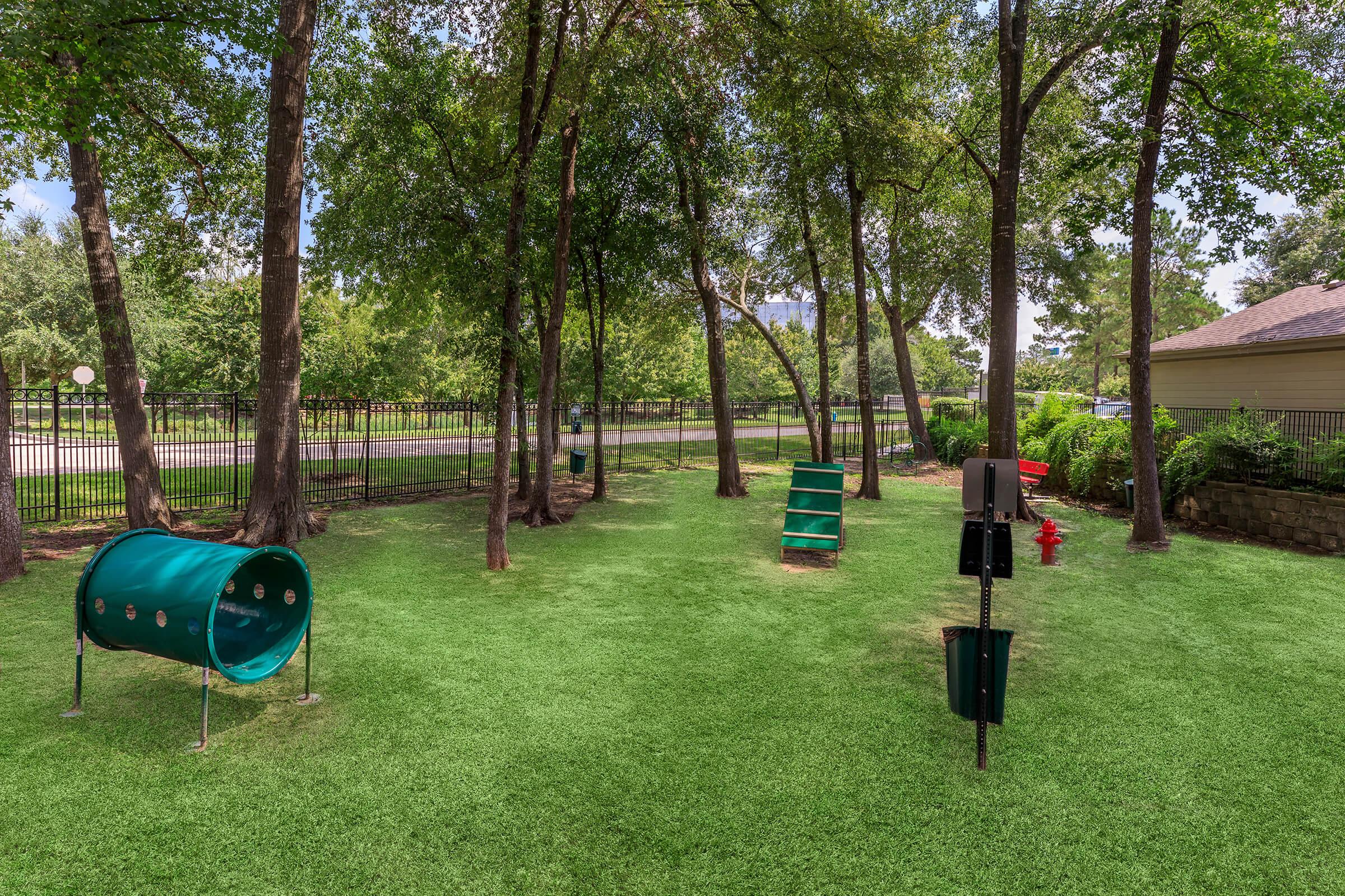 a group of lawn chairs sitting on top of a grass covered field