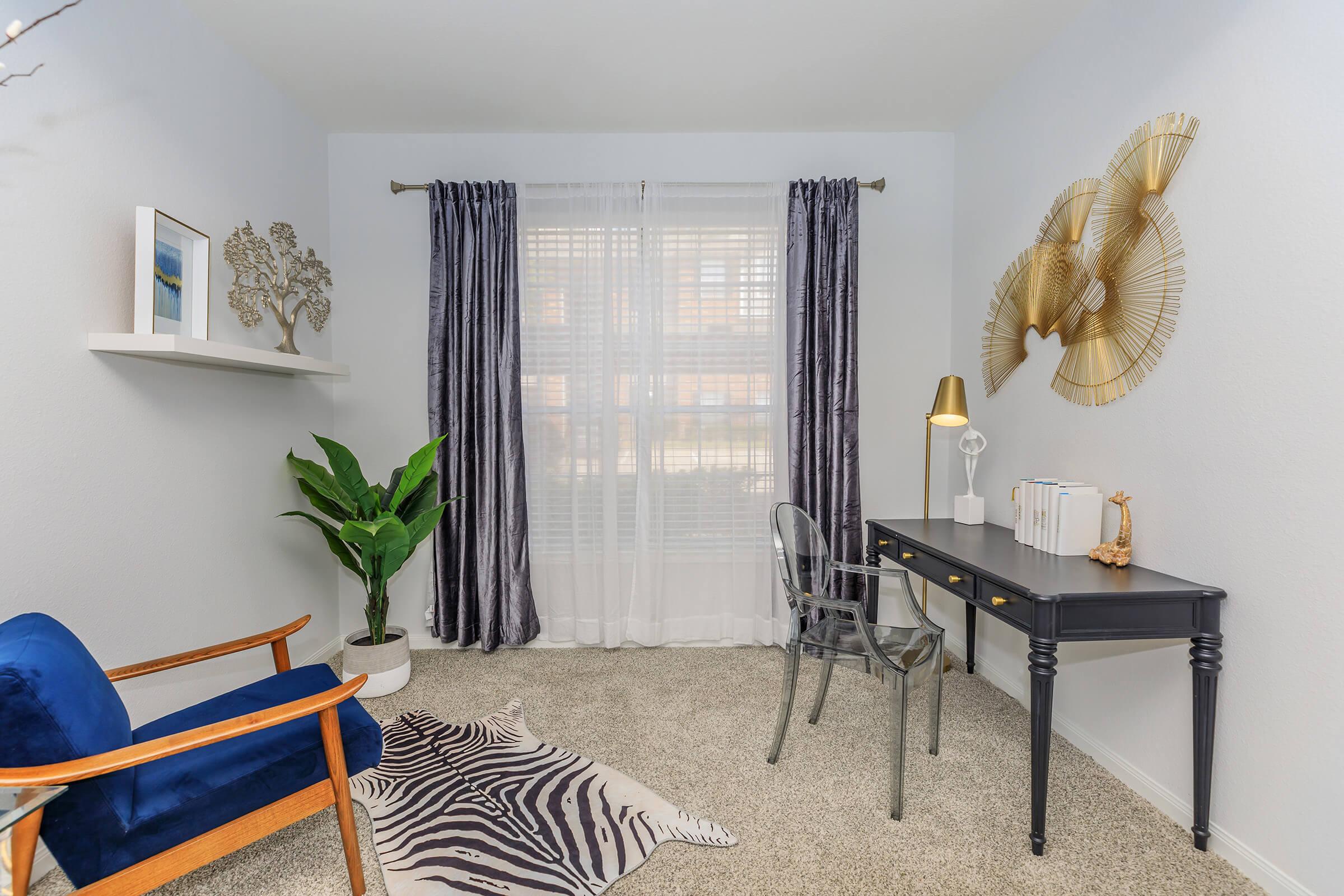 a living room filled with furniture and a window